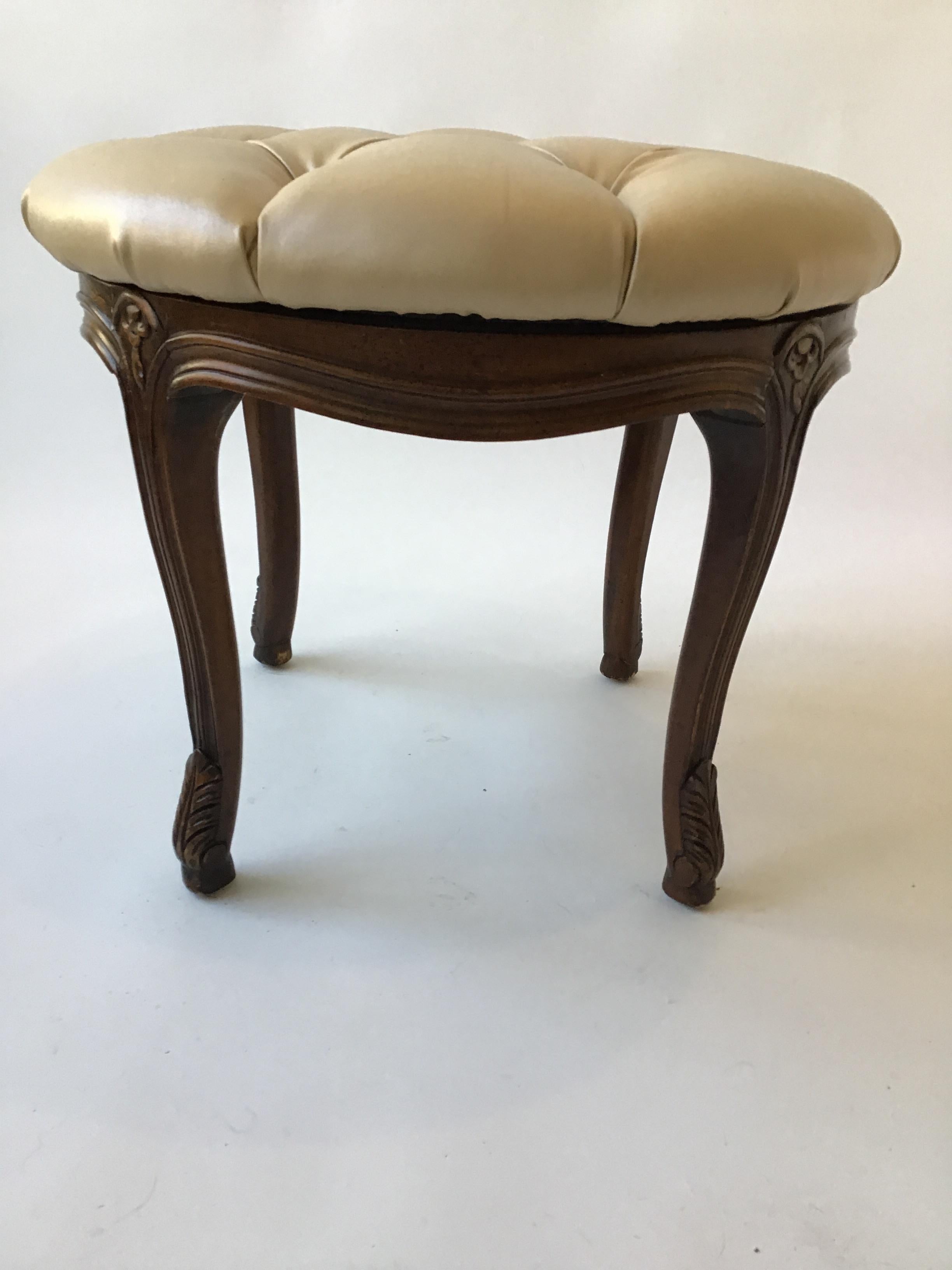 French style carved wood ottoman with revolving seat. Original vinyl fabric.