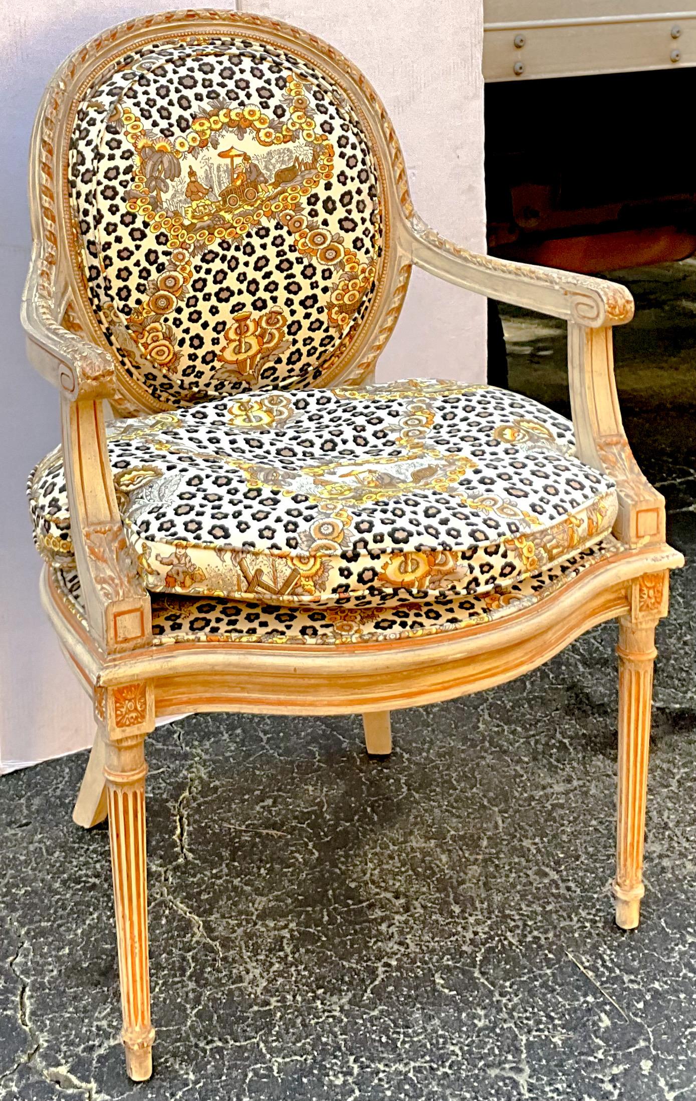This is a 1950s French cerused pine Bergere chair upholstered in the highly sought after Brunschwig and Fils leopard chinoiserie. I always love this fabric…so charming. The cerused frame appears to be pine, and it also has some painted details. The