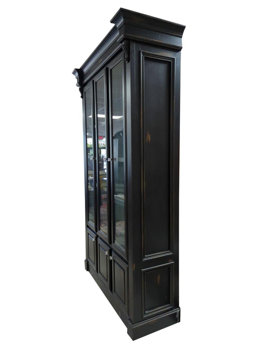From a very fine home in North Georgia, Custom made cabinet, In the style of a Habersham Plantation Furniture cabinet, Wood Frame, Cornice Top, Inset Panel Sides, 3 Glass front doors at the top, 3 solid front doors on bottom, Glass knobs, Has 3