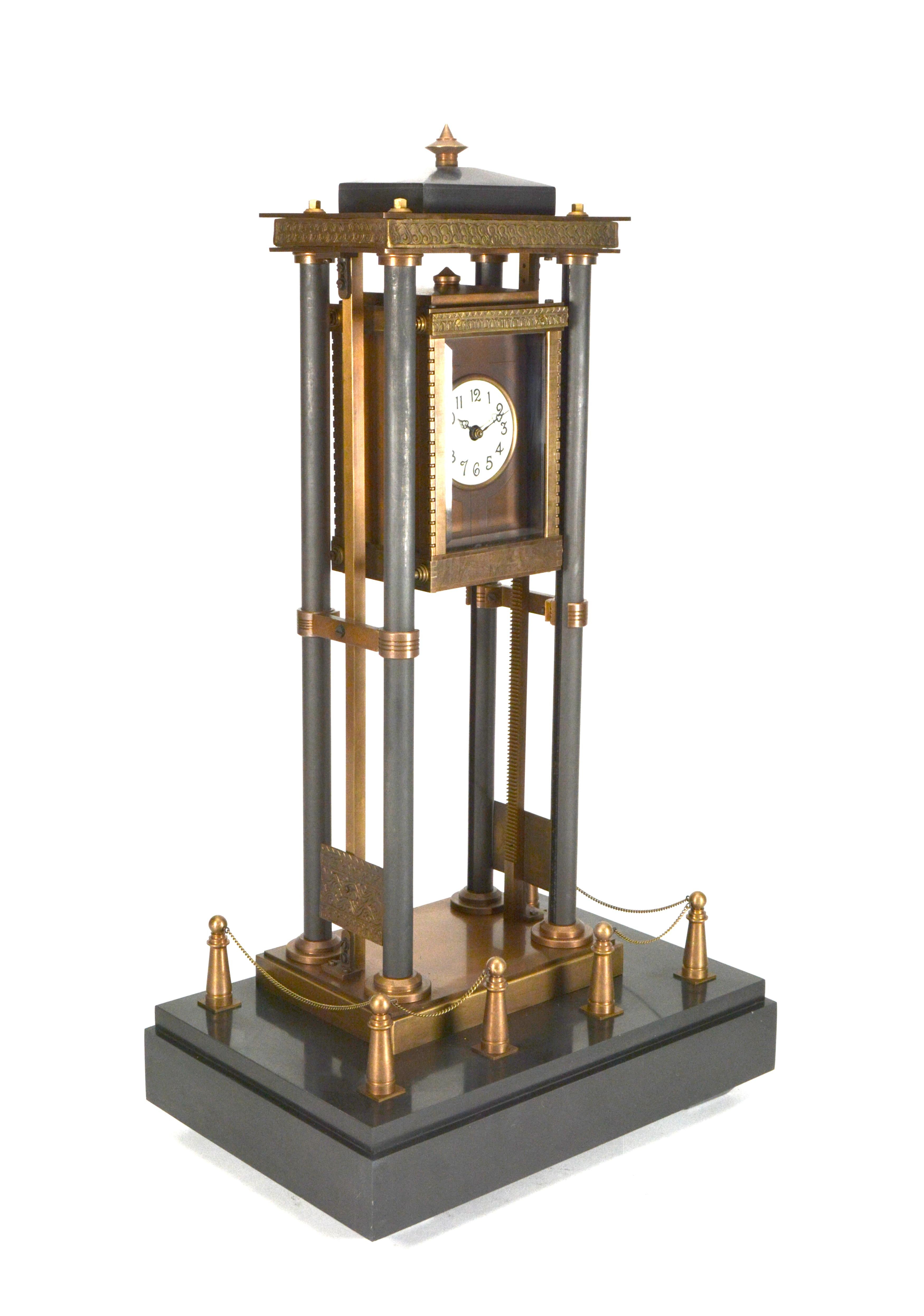 French Style Gravity Driven Industrial Elevator Industrial Clock w Marble Base

Here we have a wonderful example of the industrial series popular in French horology. This clock is driven by its own weight as it slows falls downwards on the 4 posts.