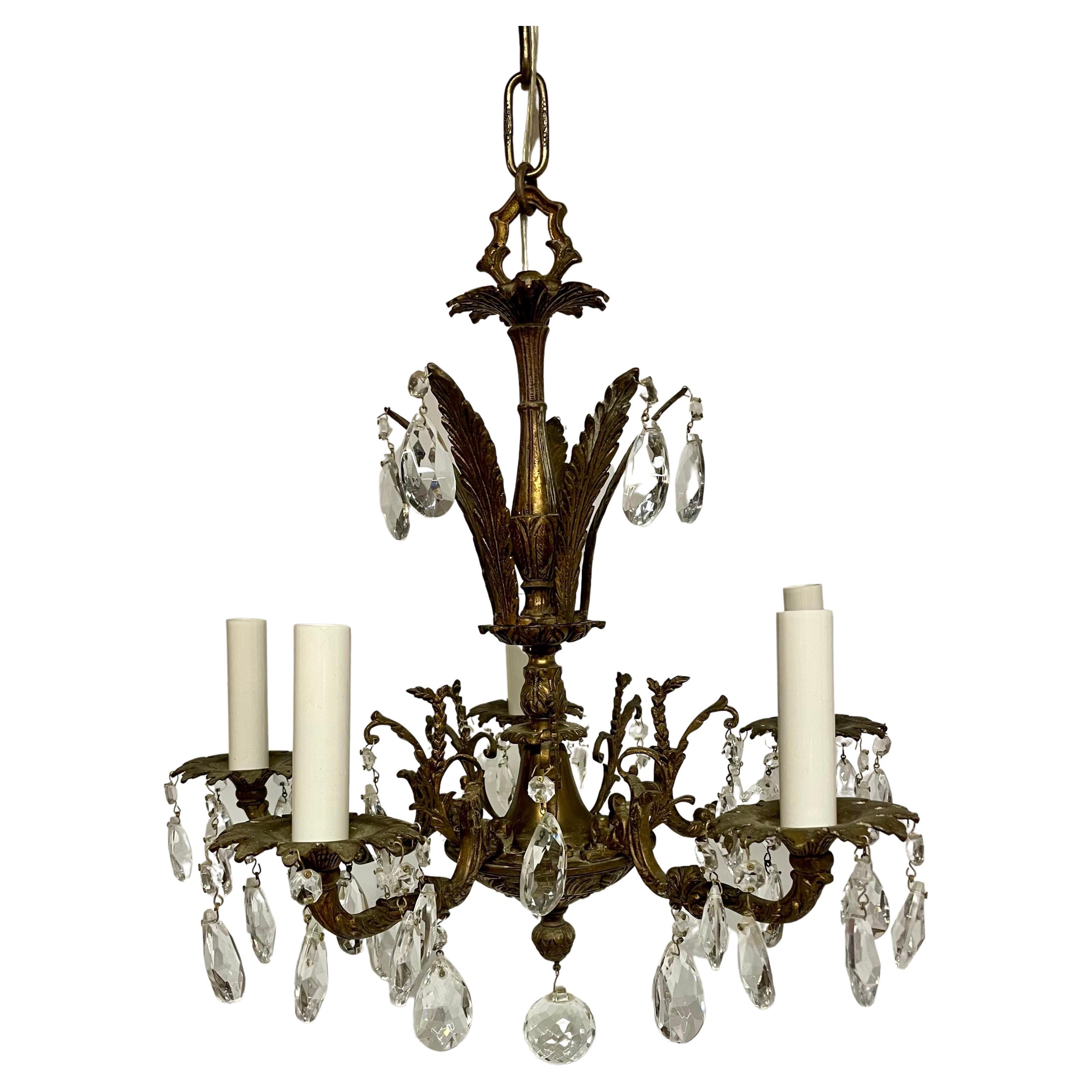 Vintage Bronze and Crystal French Style Chandelier with Five Arms. Very good detail in the bronze arms and body of the chandelier. Original shimmering crystals featuring two sizes plus large round ball adorning the bottom finial. Rewired with clear