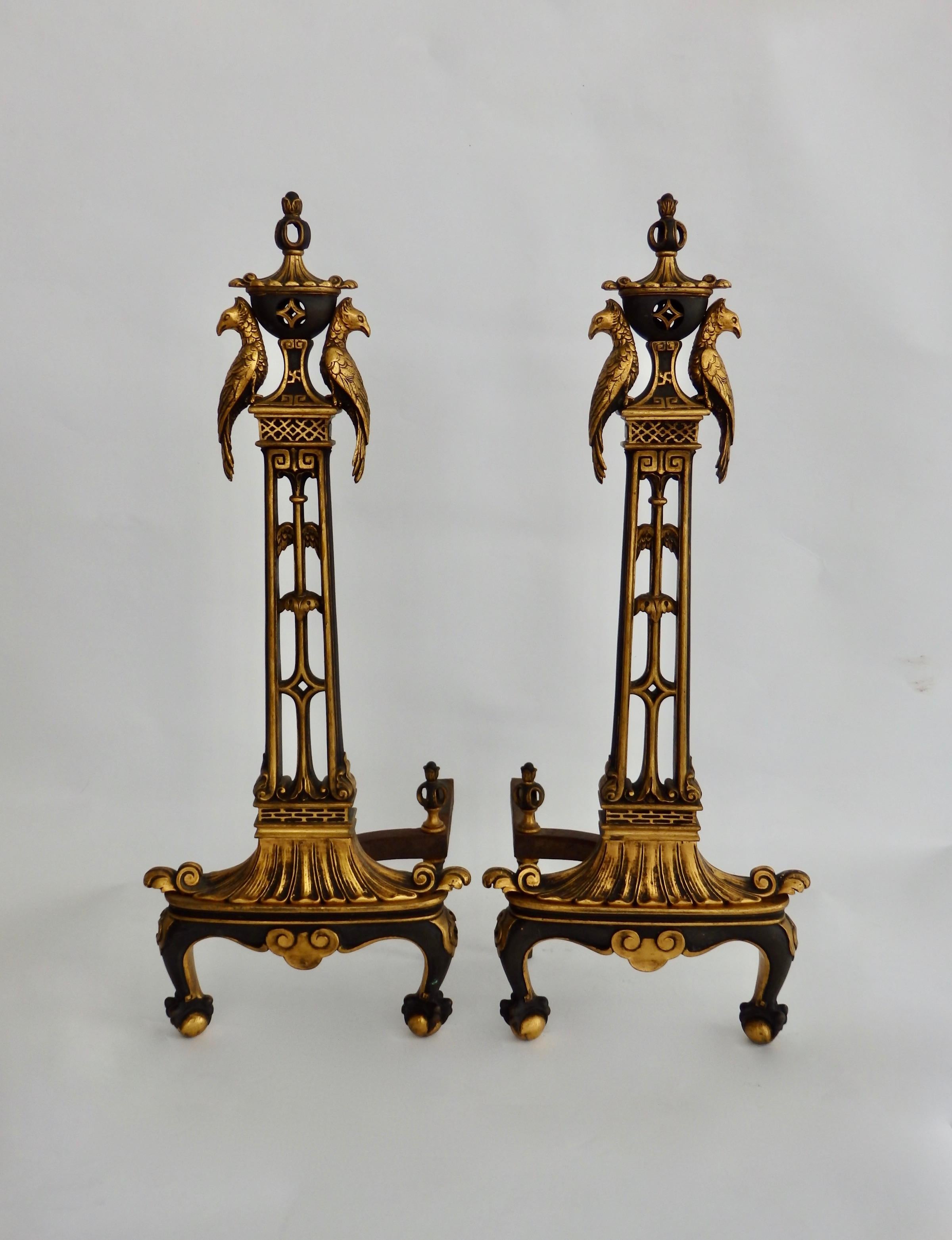 Elegant pair of bronze andirons with gold gilding. Fine original finish and patina.