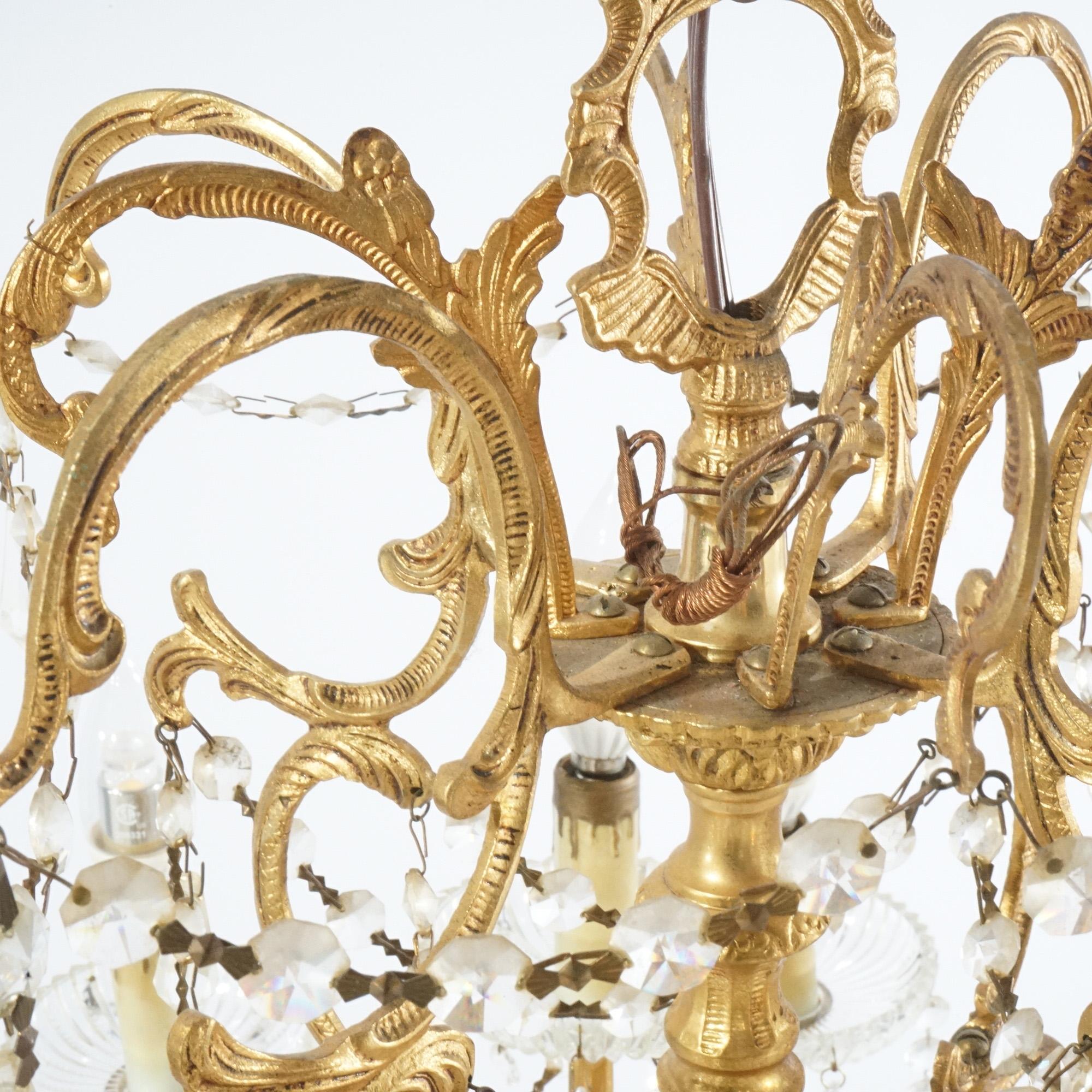 Metal French Style Gilt & Crystal Twelve-Light Tiered Chandelier, Circa 1930 For Sale