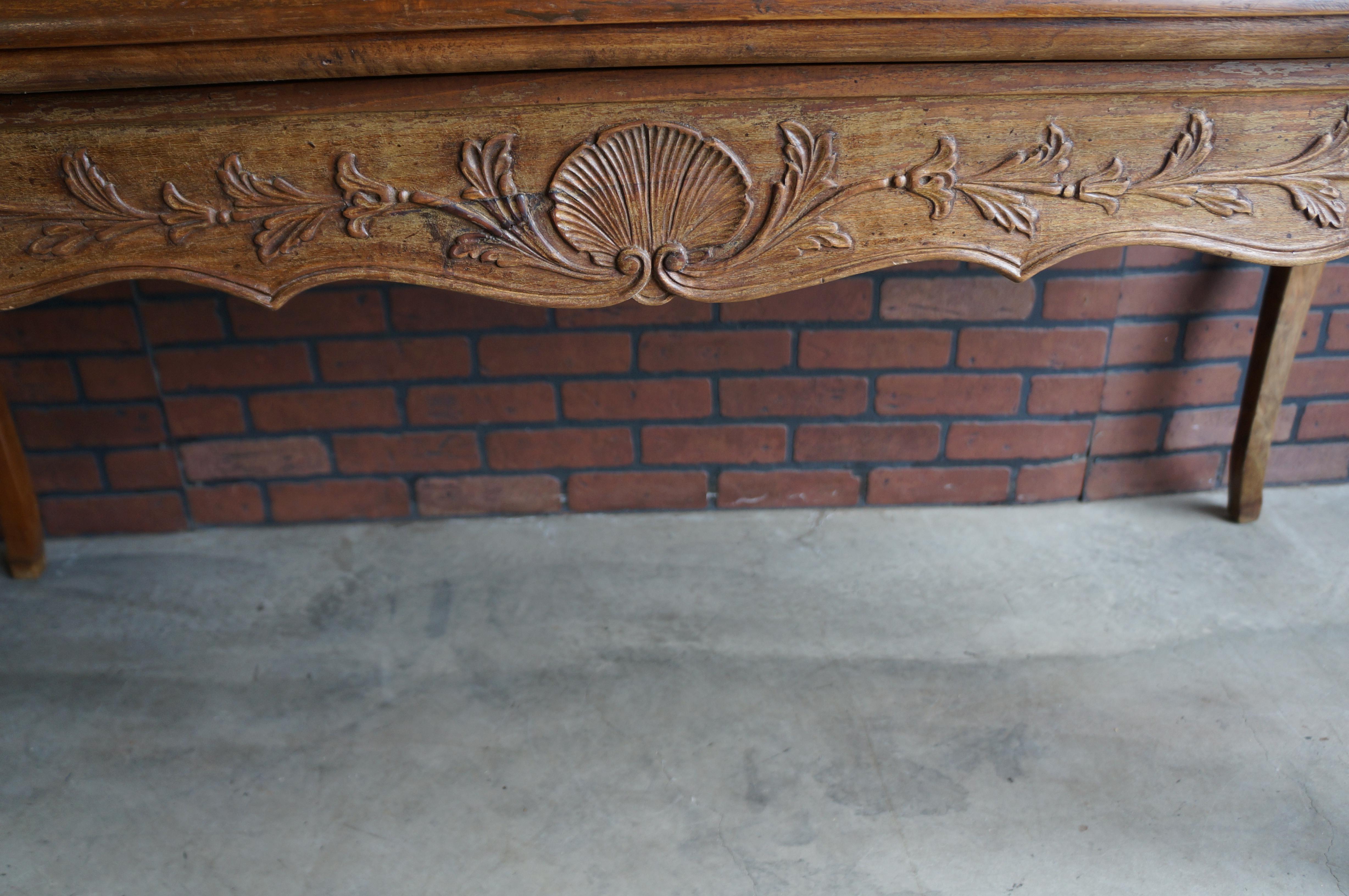 Distinguished European furniture design is apparent with this Italian hand carved table desk. The splendid carvings are on all sides of the apron giving this desk amazing versatility. Finely crafted in Italy for Bloomingdales. Add a touch of French