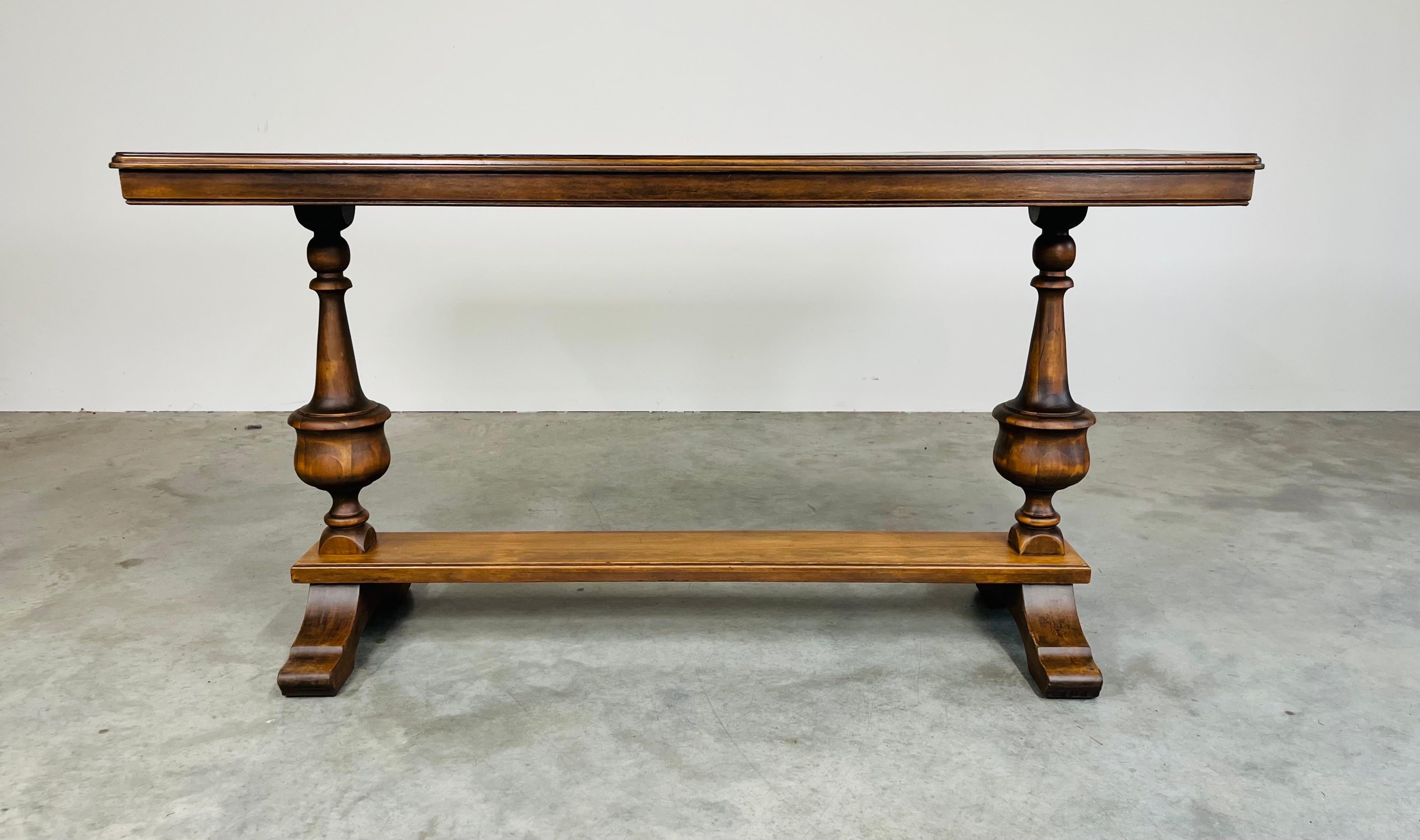 An elegant refectory library console table in solid mahogany having turned spindle pedestal legs by Kiel Furniture circa 1930. 
In excellent refinished condition having carefully cleaned and naturally treated mahogany wood. Ready for use! 
Measures