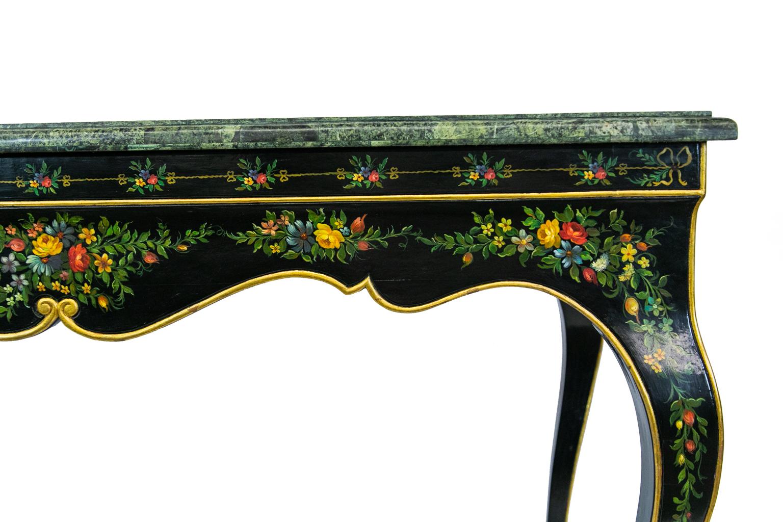 French style marble-top center table has bull nosed edge overlaid with green marble panels in various sizes which are glued together to create an interesting effect. The base is hand painted with colorful flowers and ribbons highlighted with gold