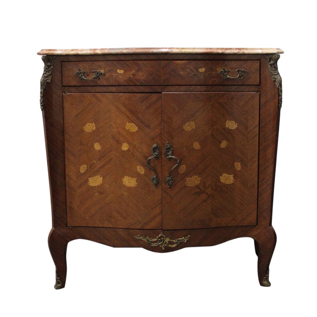 C. 20th Century

French style marble top two door cabinet w/ single drawer brass mounting & marquetry.