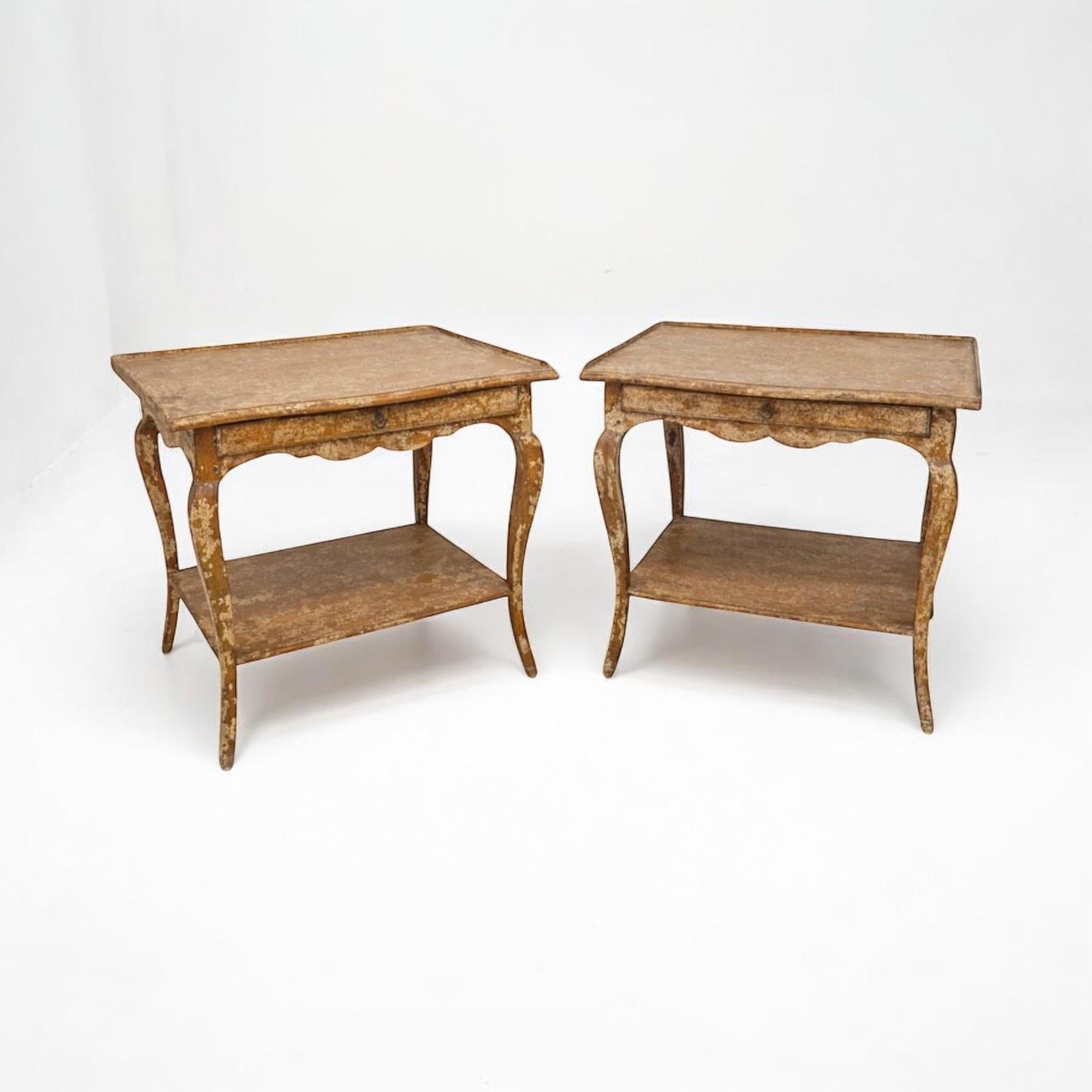 This is a pair of carved fruitwood side tables crafted in Los Angeles by Minton-Spidell. They have a rustic antique finish. They are marked. 

Shipping is running two to five weeks. Local pick up is by appointment. For any destinations in golfing a
