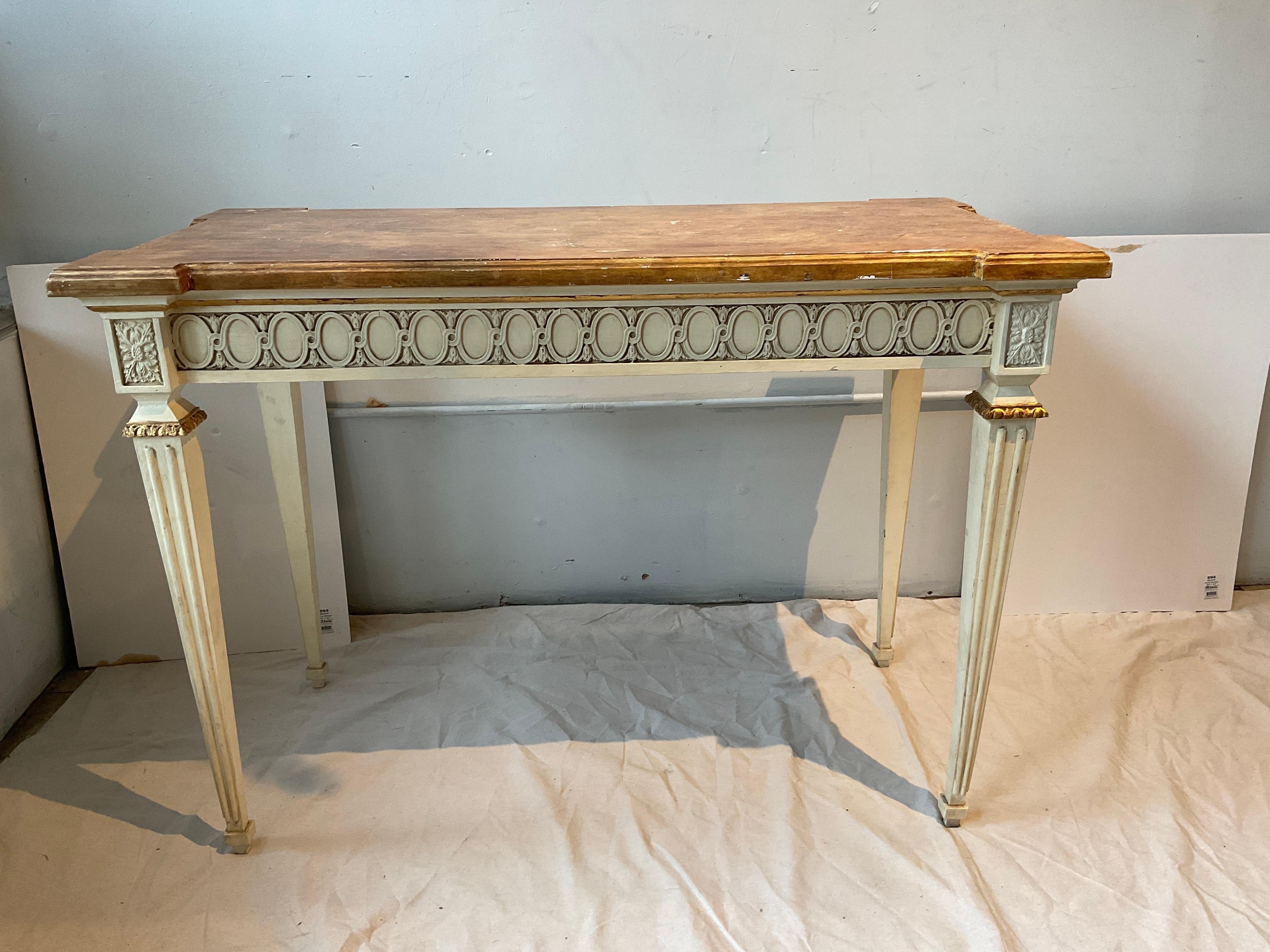Painted wood French style Regency console. Faux finish top, gold accents.
Finish missing in places on top.