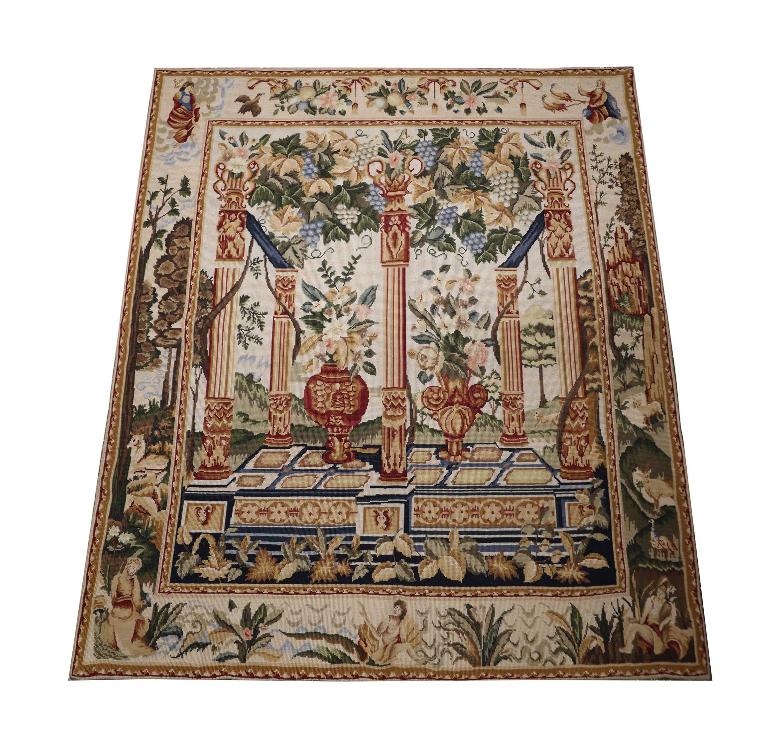 This elegant french style tapestry was woven by hand in china in the early 21st century. The design features vases and pillars that have been decorated with bold floral patterns and grapevines. The design is realistic and catches the eye with its