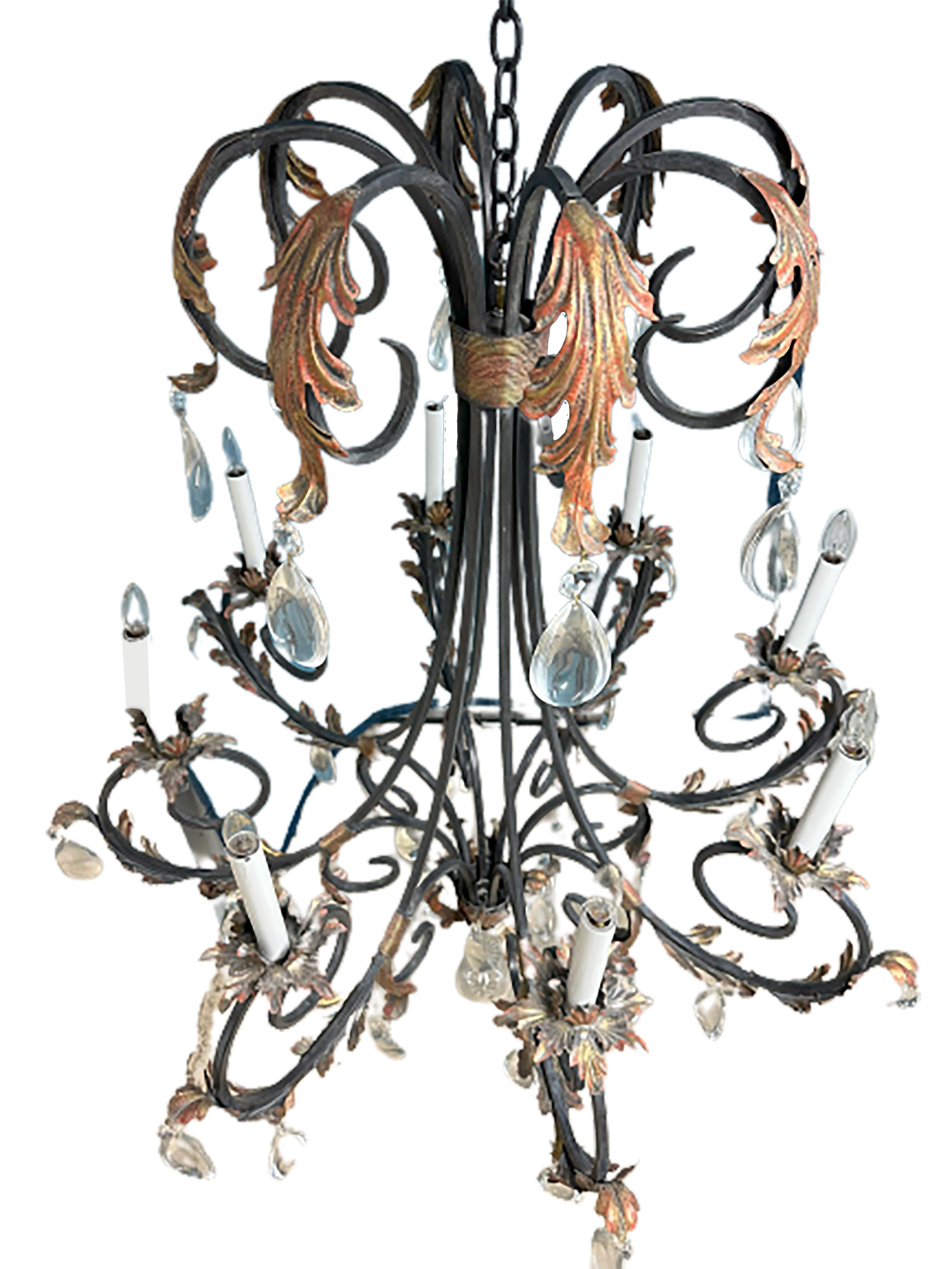 A handsome pair of handmade French style chandeliers. Early 21st century made. Wrought iron with frenchScrolls and acanthus leaves. Rock Crystal Droplets adorn the structure. 

In very good condition. Some gentle wear consistent with age and