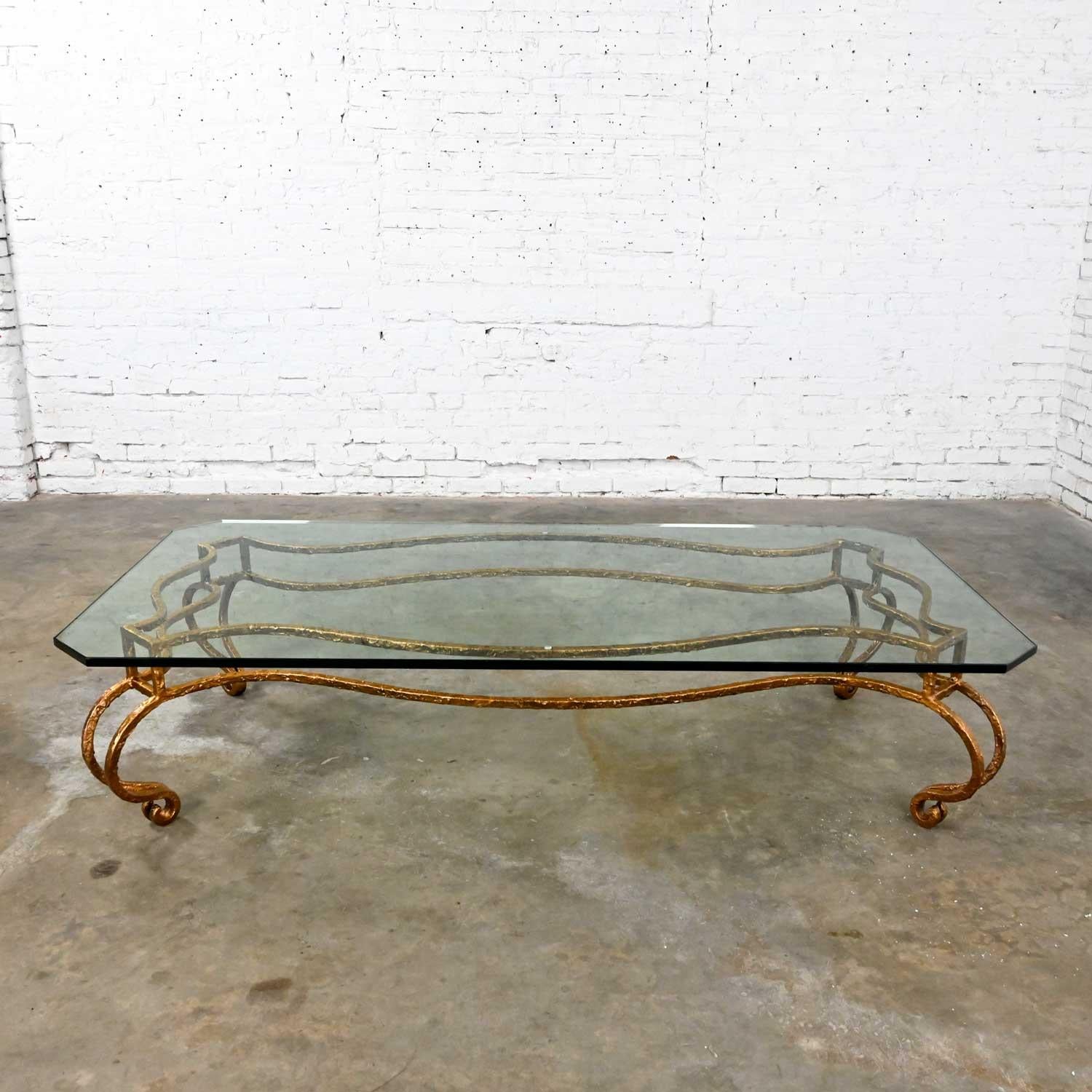 Fabulous French style wrought iron base and ¾ inch thick rectangular glass top coffee table with angled corners in the style of Maison Ramsay. Beautiful condition, keeping in mind that this is vintage and not new so will have signs of use and wear.