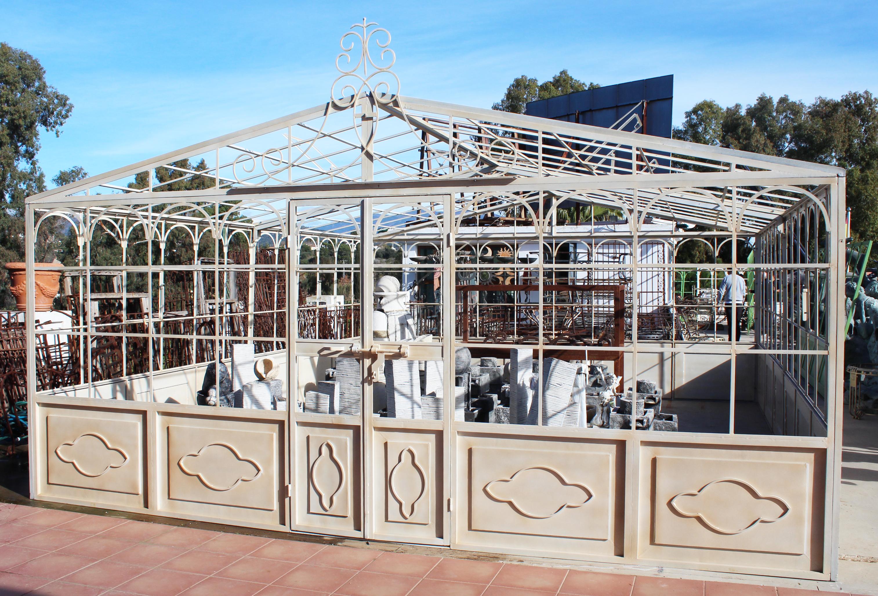 French style wrought iron greenhouse with doors and windows that open outwards. Ready for glass panels to be installed.