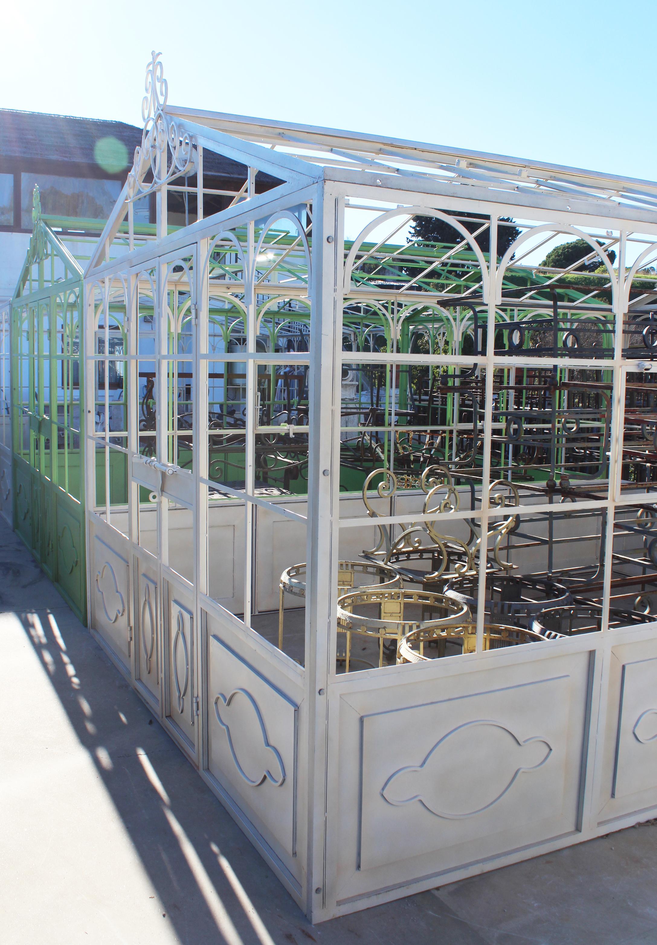 French style wrought iron greenhouse with doors and windows that open outwards. Ready for glass panels to be installed.