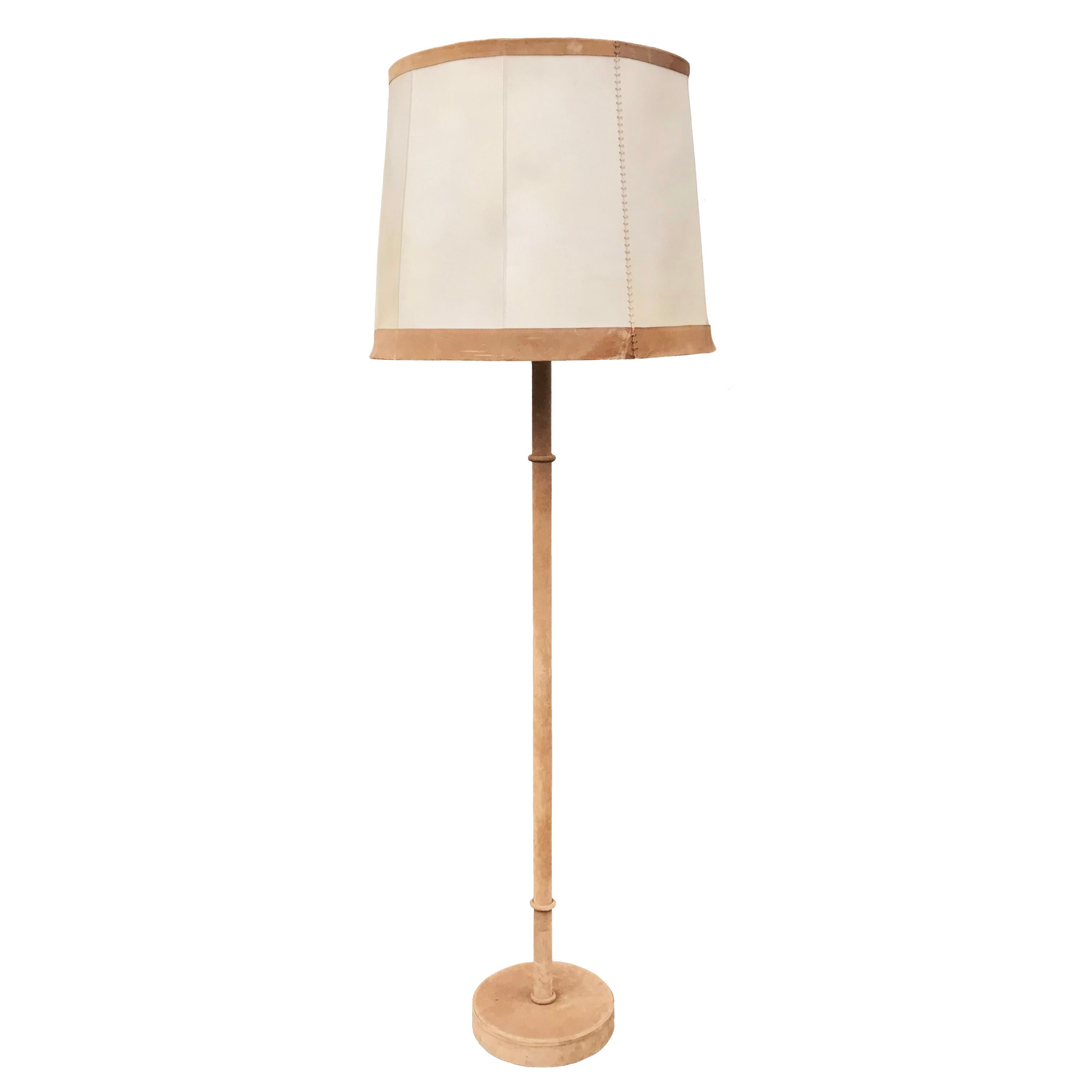 Incredibly chic suede-covered tall standard lamp with its original stitched parchment shade and brass central rod topped off with a suede finial.