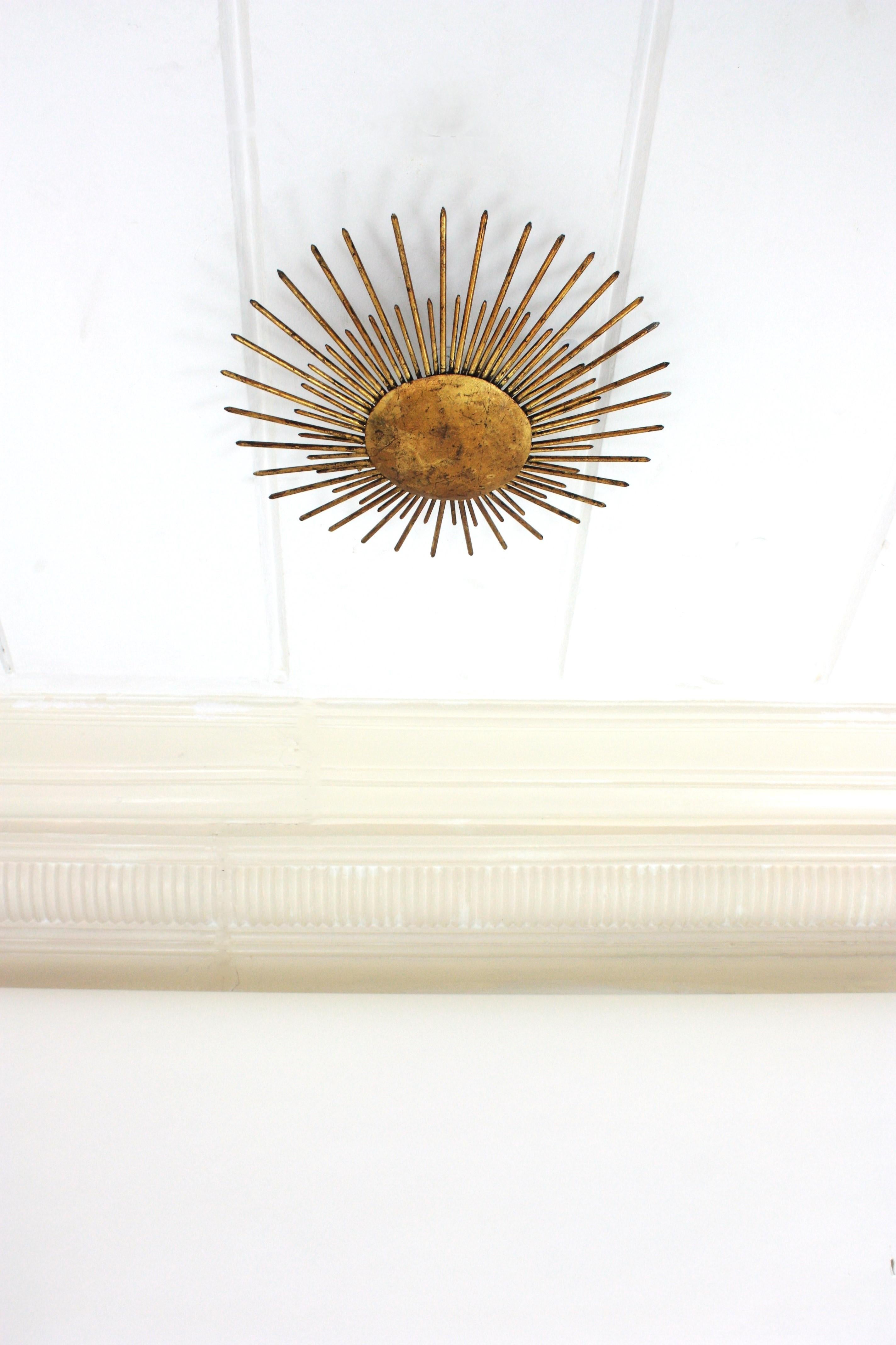Art Deco French Sunburst Ceiling Light Fixture in Gilt Wrought Iron, 1940s For Sale