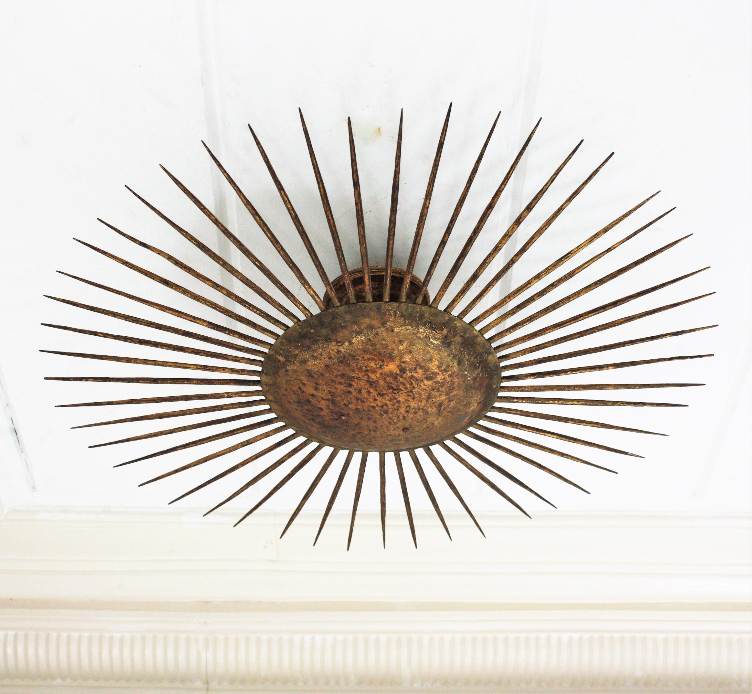 Metal French Sunburst Ceiling Light Fixture in Gilt Wrought Iron, 1940s For Sale