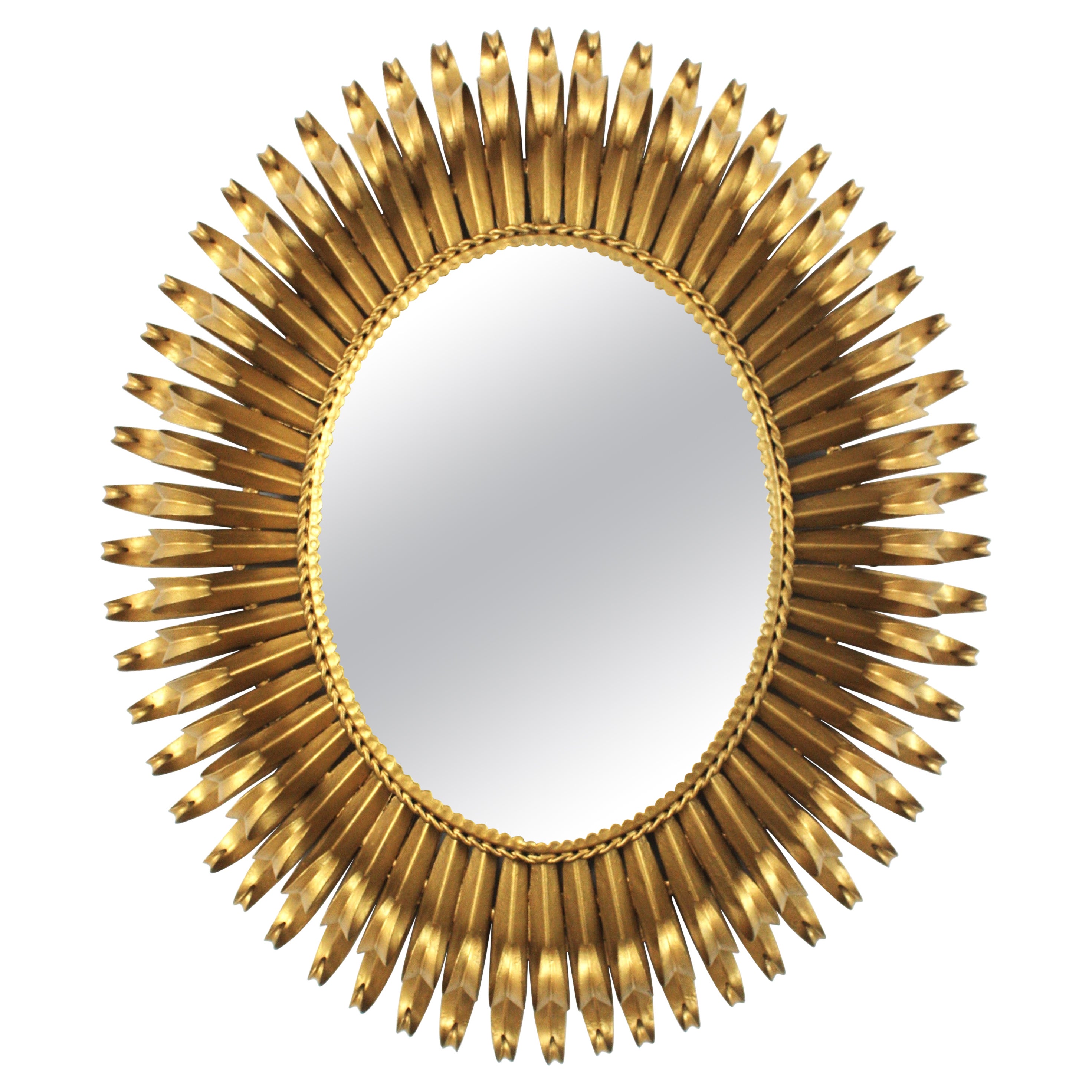 French Sunburst Eyelash Oval Mirror in Gilt Wrought Iron 
Beveled Glass, 1950s For Sale