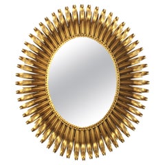 French Sunburst Eyelash Oval Mirror in Gilt Wrought Iron & Beveled Glass, 1950s