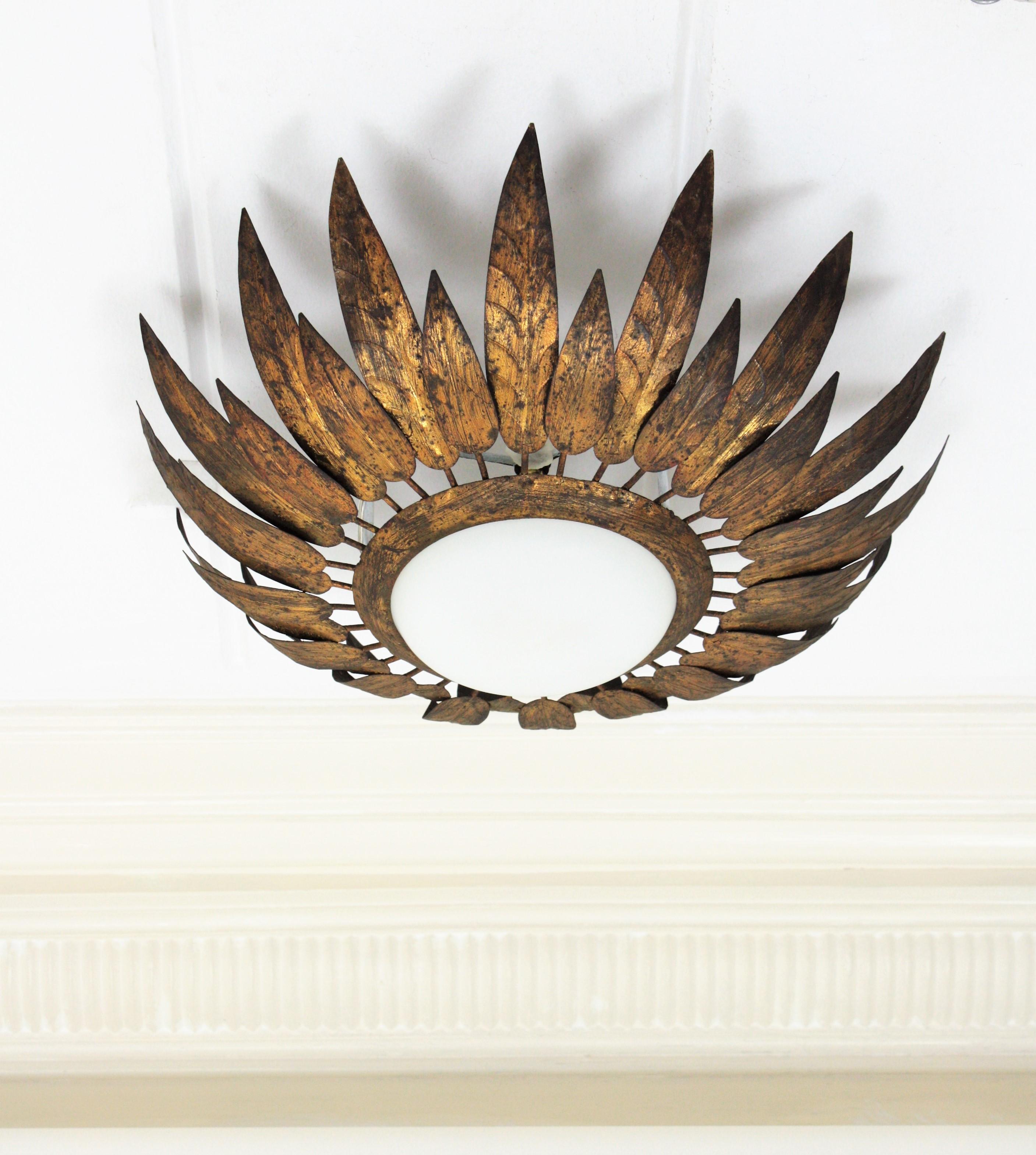 French Sunburst Flush Mount with Feathers Frame in Gilt Iron & Milk Glass, 1950s In Good Condition In Barcelona, ES