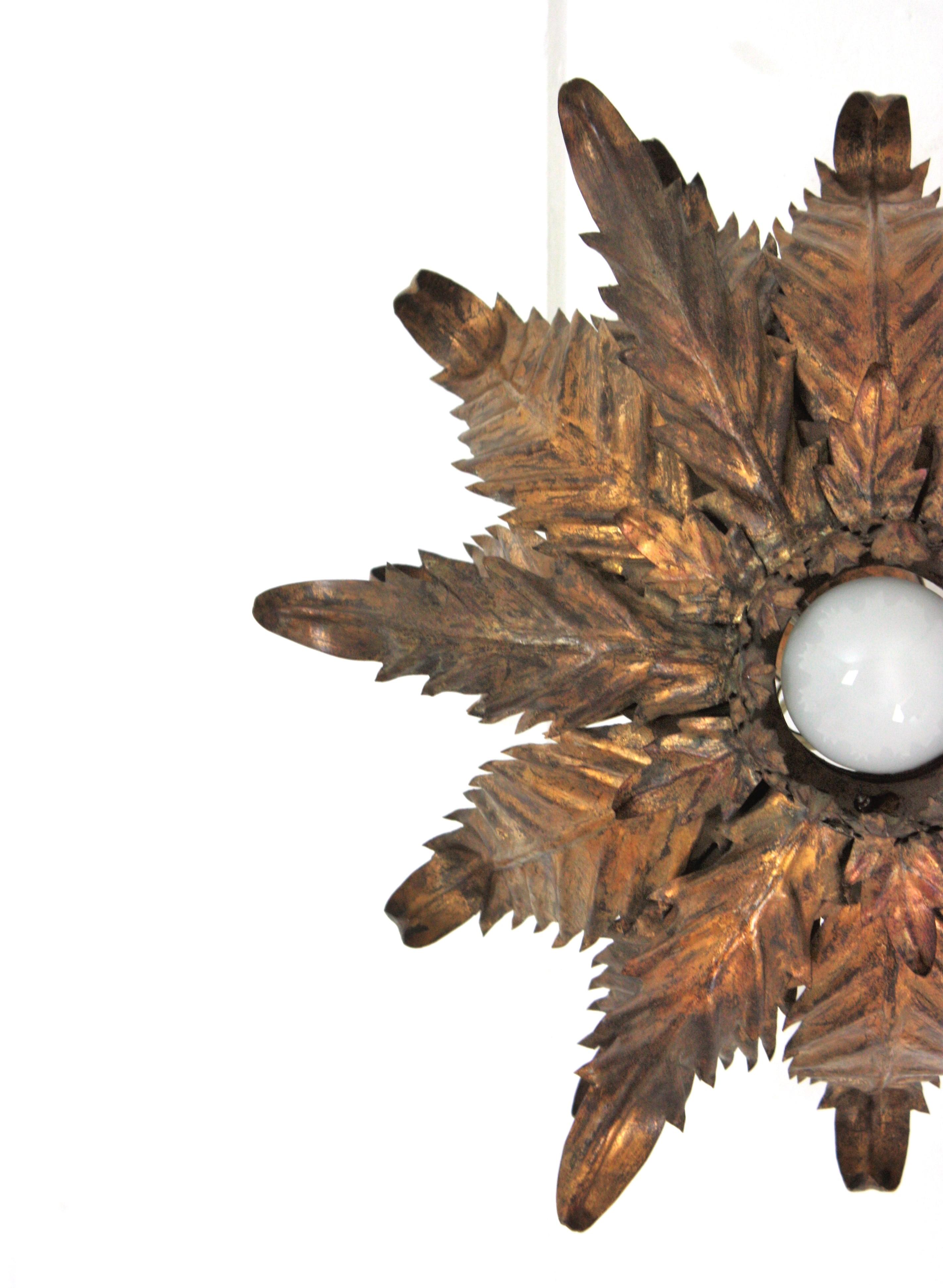 French Sunburst Foliage Ceiling Light Fixture / Chandelier in Gilt Iron, 1940s For Sale 1