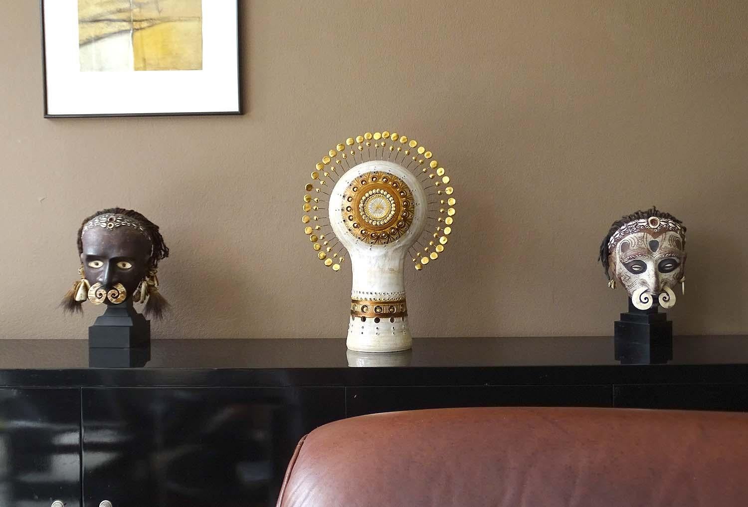 Spectacular handcrafted French midcentury ceramic and clay TOTEM table lamp, circa 1970 by sculptor Georges Pelletier, cream white glazed body punctuated with gold spheres in lower section, sunburst crown with two level gold enameled clay stones,