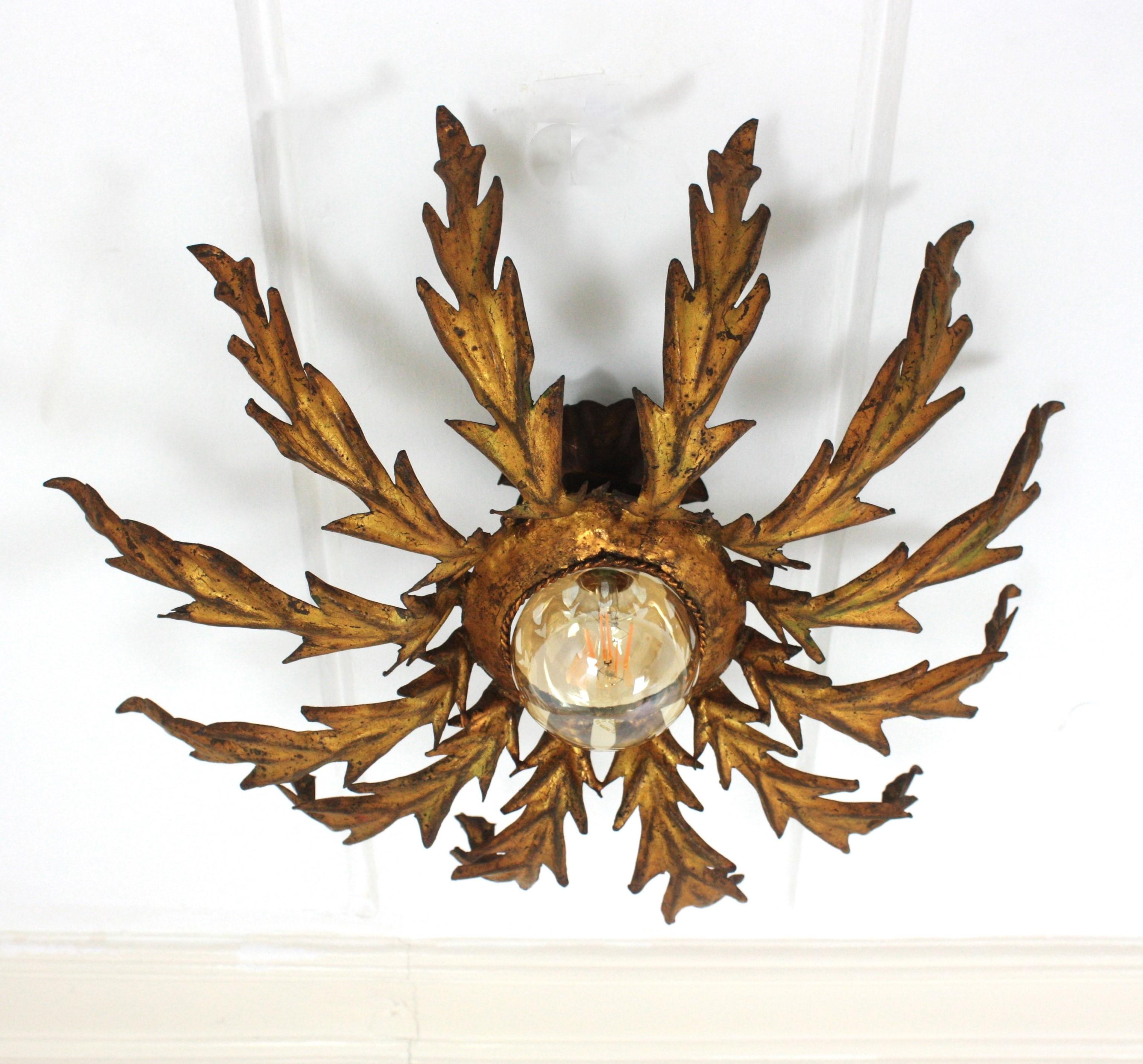Hand-Crafted French Sunburst Leafed Ceiling Light Fixture in Gilt Iron, 1940s For Sale