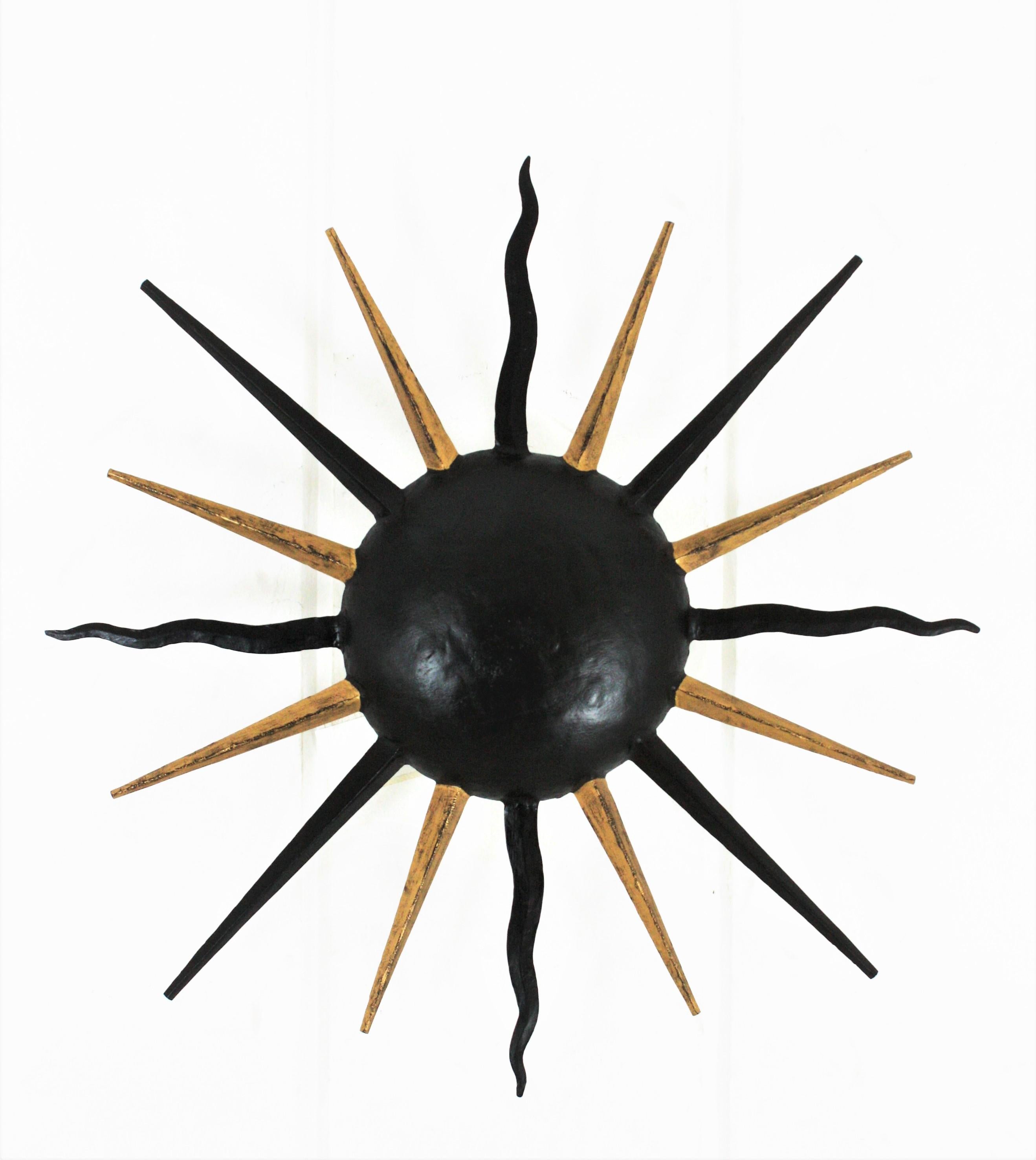 French Sunburst Light Fixture in Black and Gilt Iron, Gilbert Poillerat Style For Sale 1