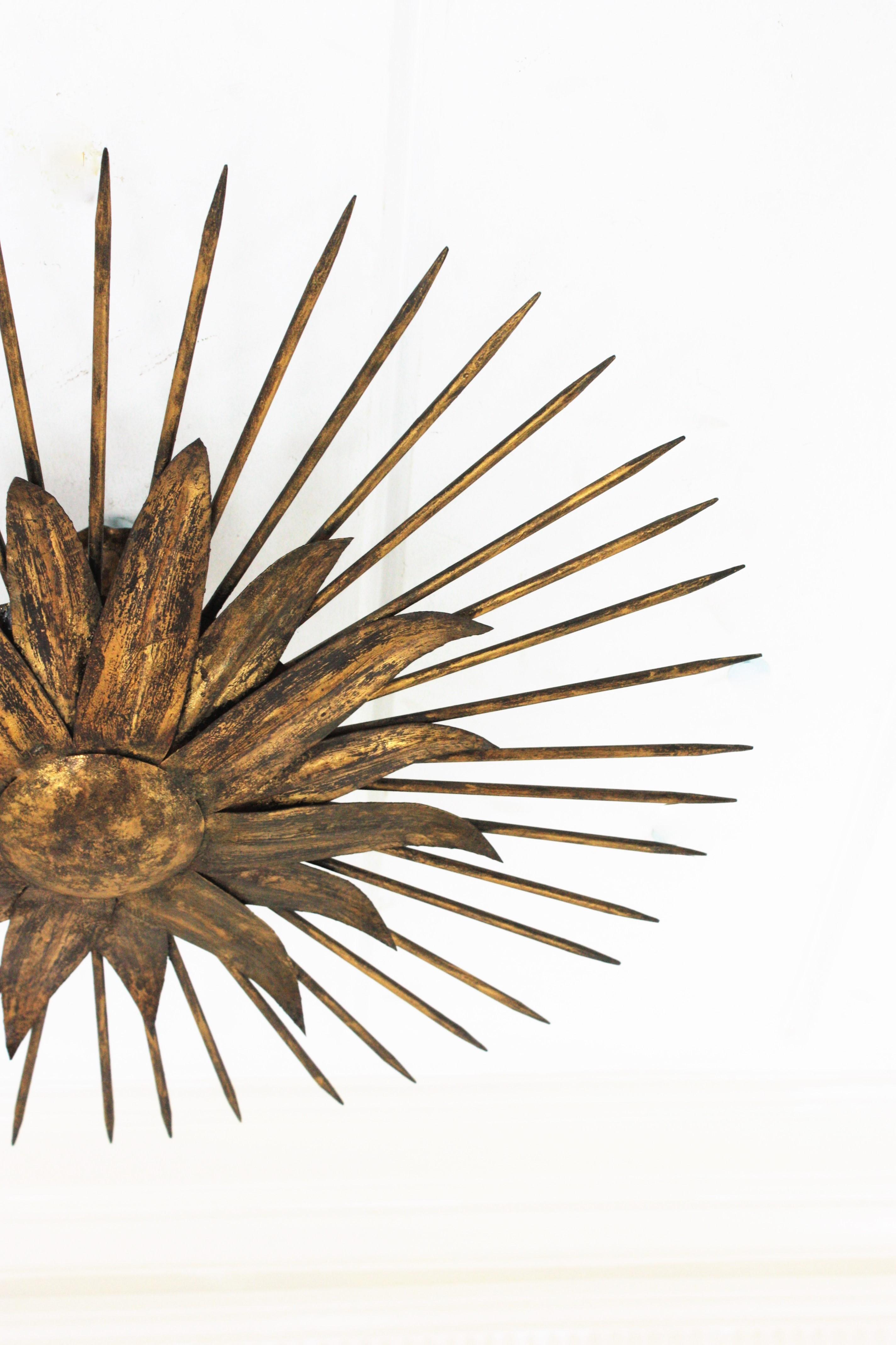 French Sunburst Light Fixture in Gilt Iron with Nail Detail, 1940s For Sale 4