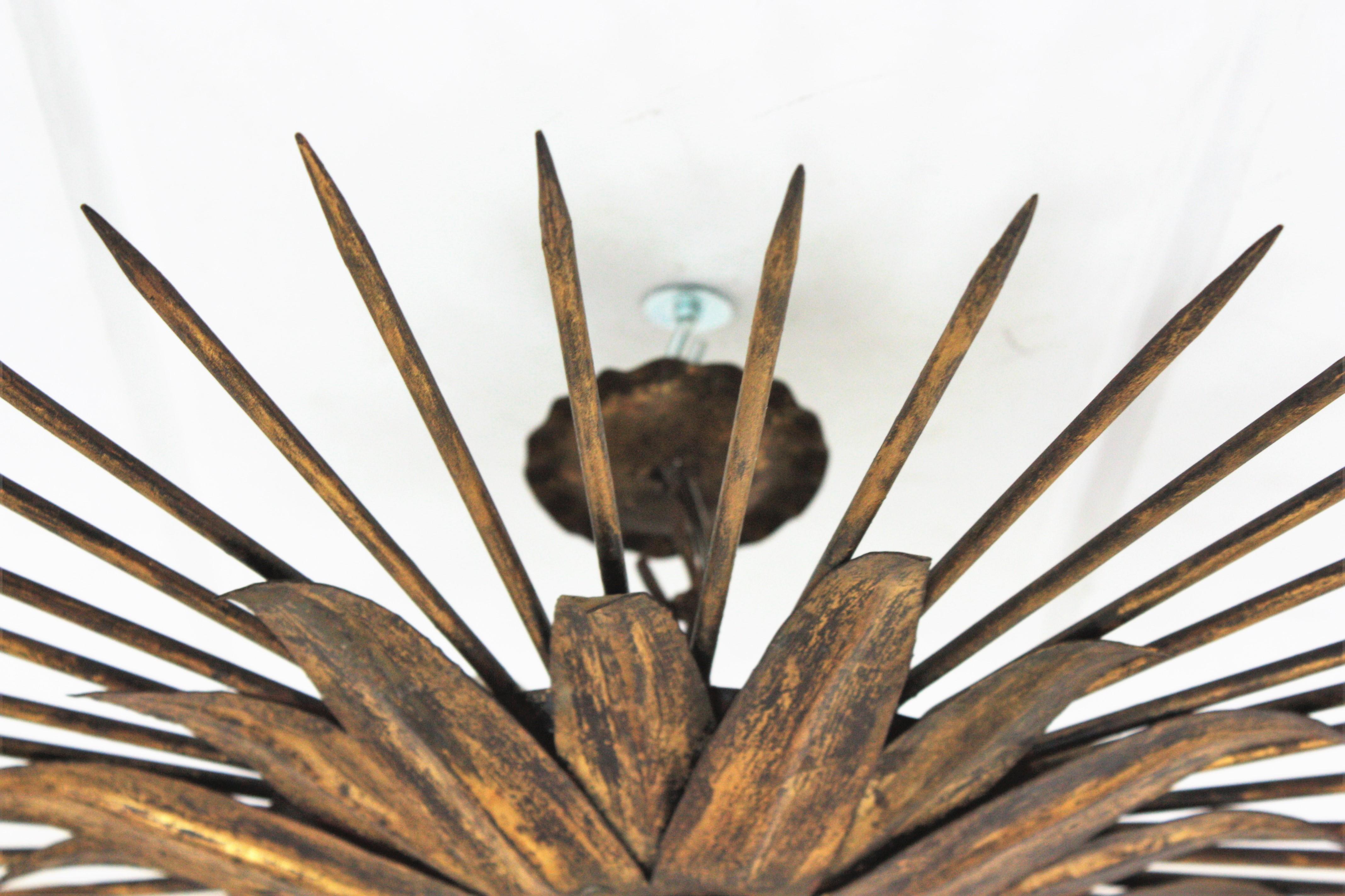 French Sunburst Light Fixture in Gilt Iron with Nail Detail, 1940s For Sale 9