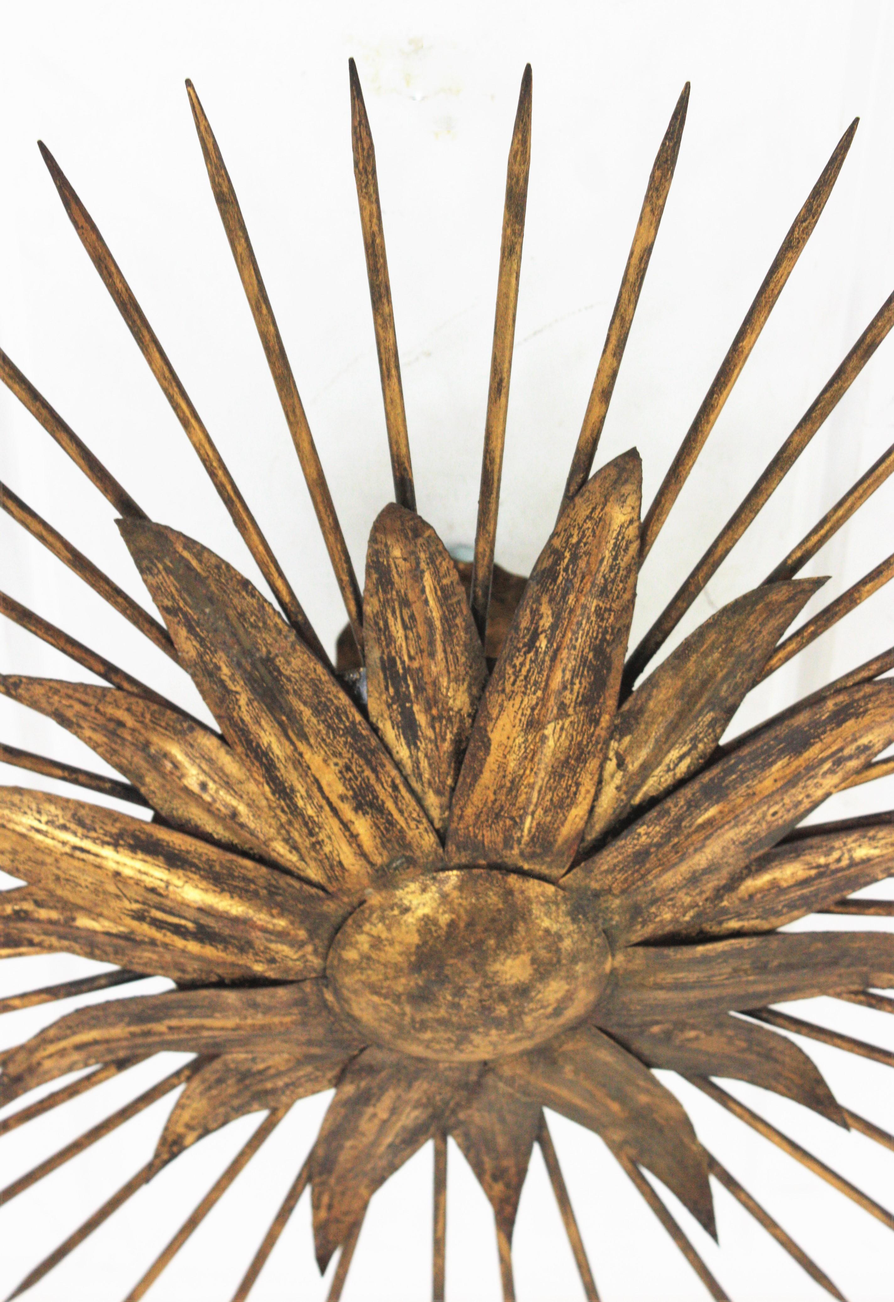 French Sunburst Light Fixture in Gilt Iron with Nail Detail, 1940s For Sale 1