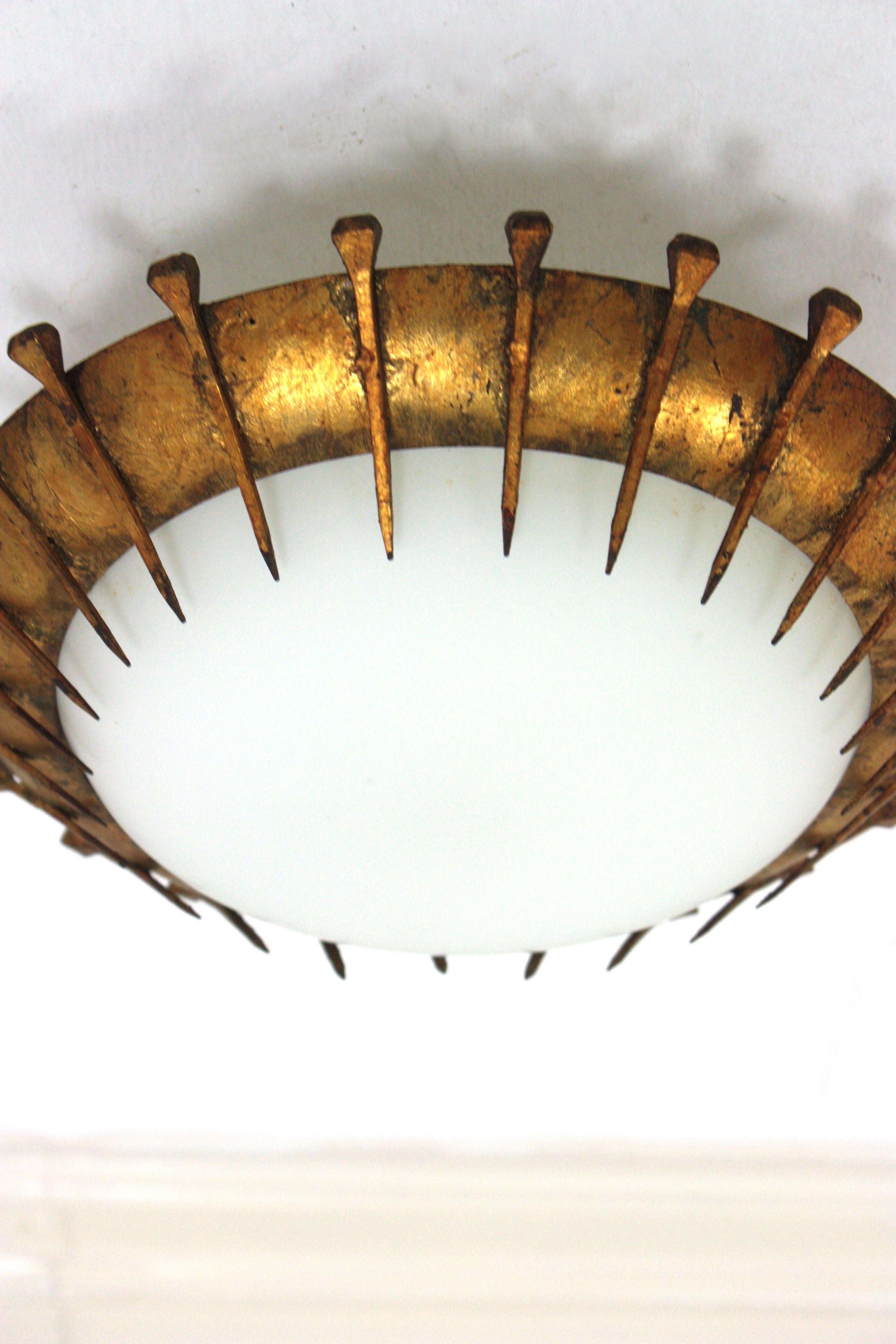 20th Century French Sunburst Light Fixture with Nail Design, Gilt Iron and Milk Glass  For Sale