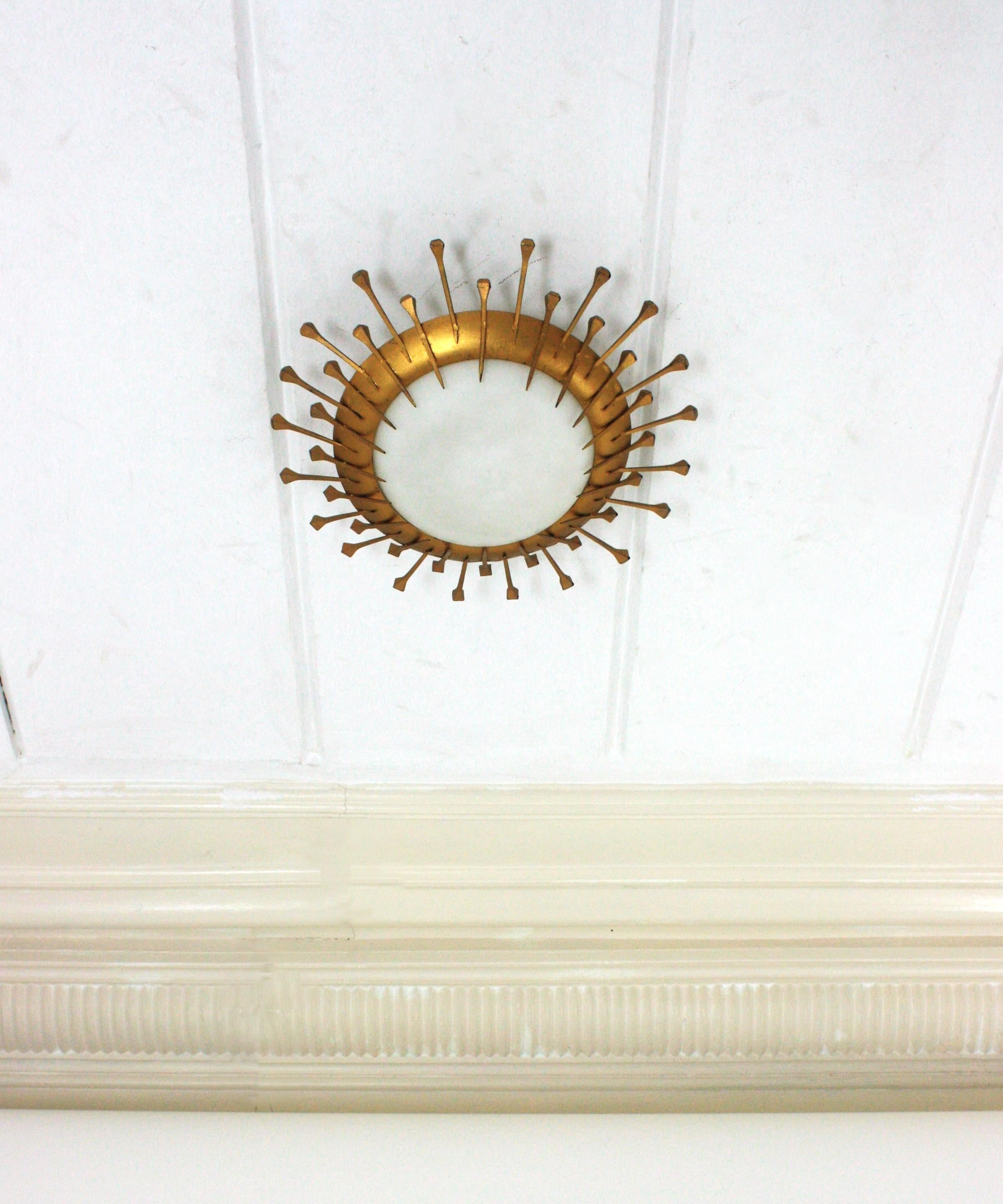 Hammered French Sunburst Light Fixture with Nail Design, Gilt Iron, Milk Glass For Sale