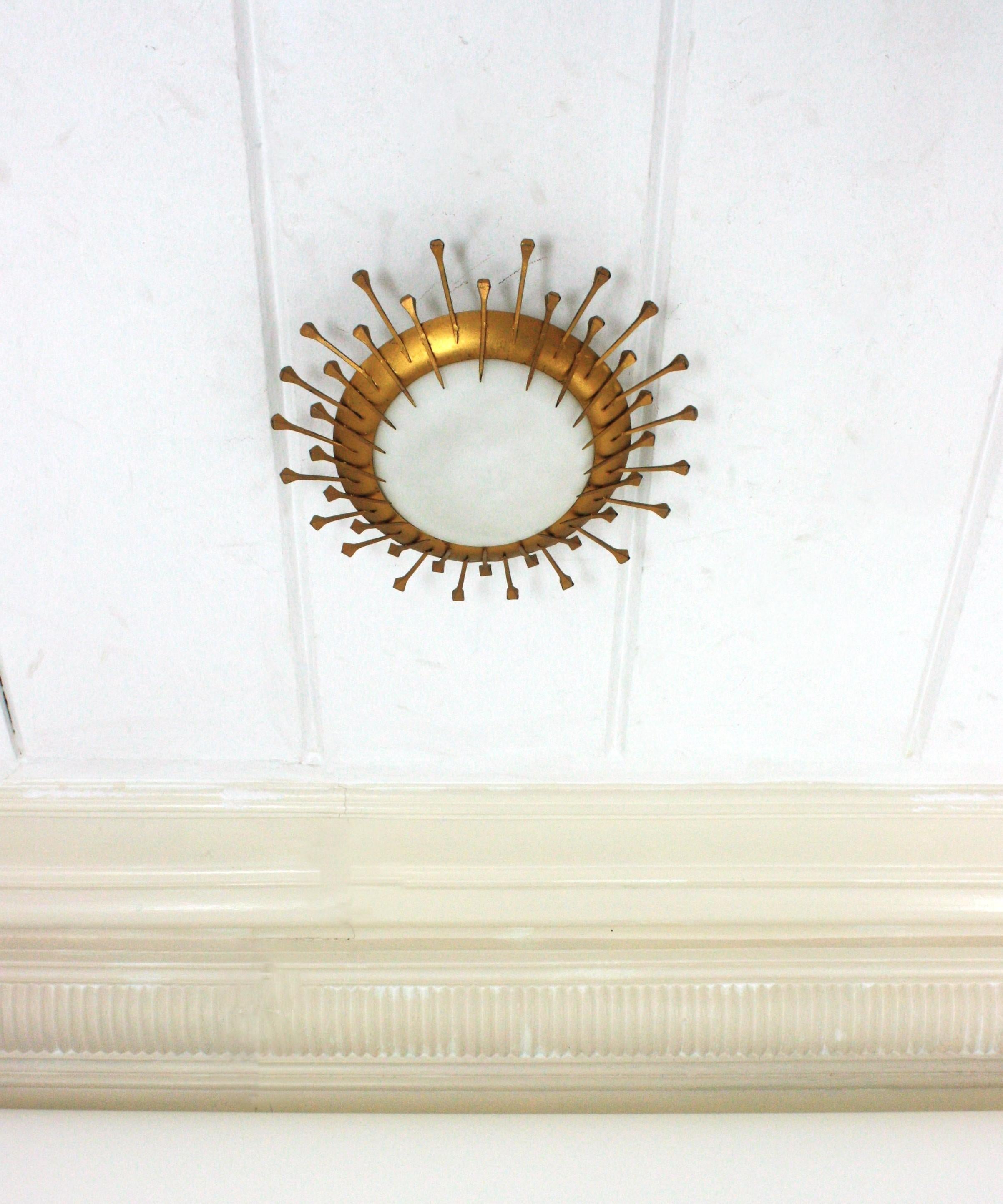 Brutalist French Sunburst Light Fixture with Nail Design, Gilt Iron, Milk Glass For Sale