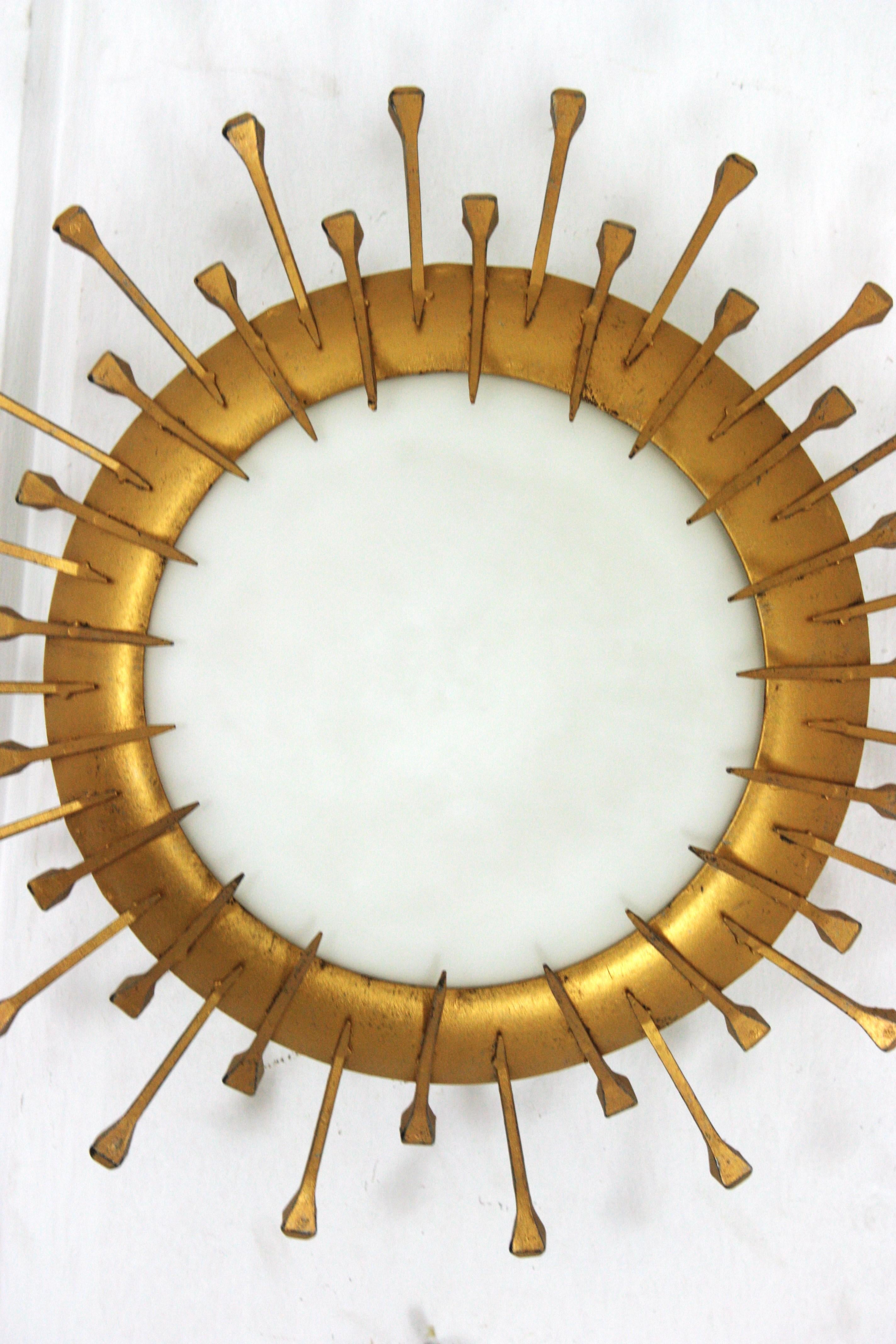 French Sunburst Light Fixture with Nail Design, Gilt Iron, Milk Glass In Good Condition For Sale In Barcelona, ES