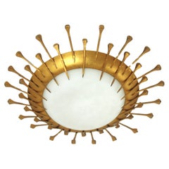 Lámpara francesa Sunburst con diseño de clavos, hierro dorado, cristal de leche