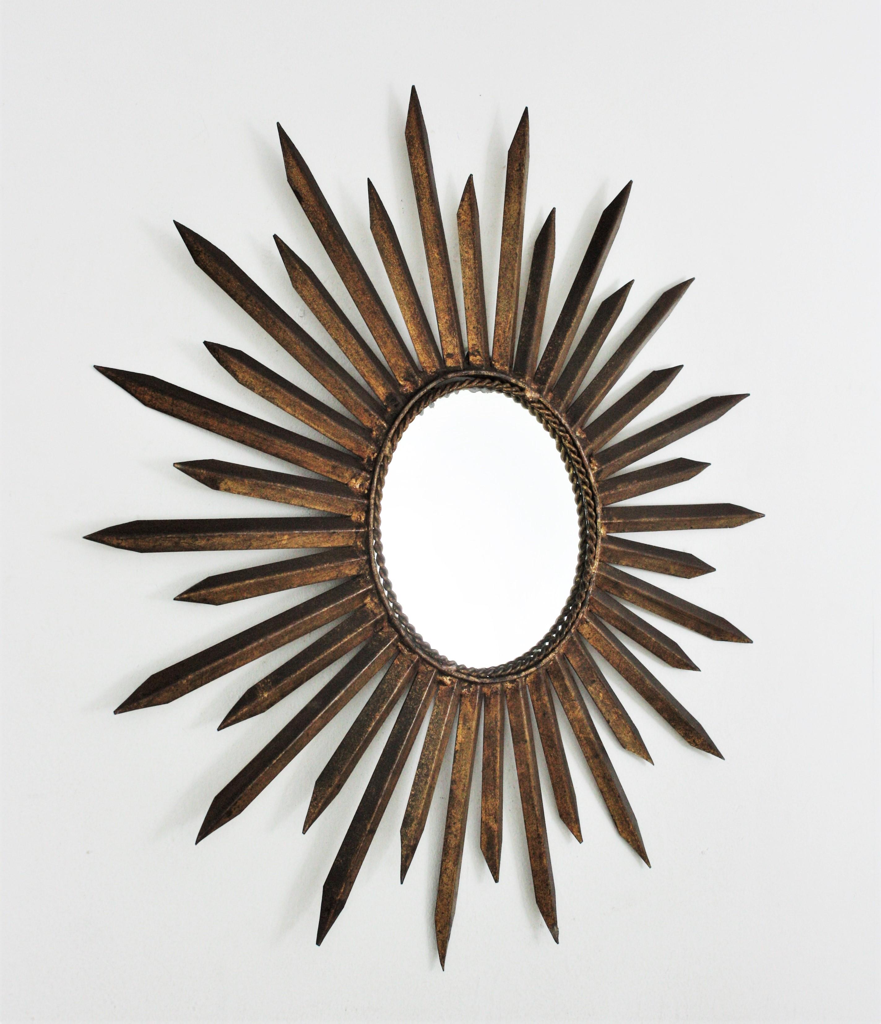 Brutalist French Sunburst Starburst Mirror in Gilt Iron, Gilbert Poillerat Style For Sale