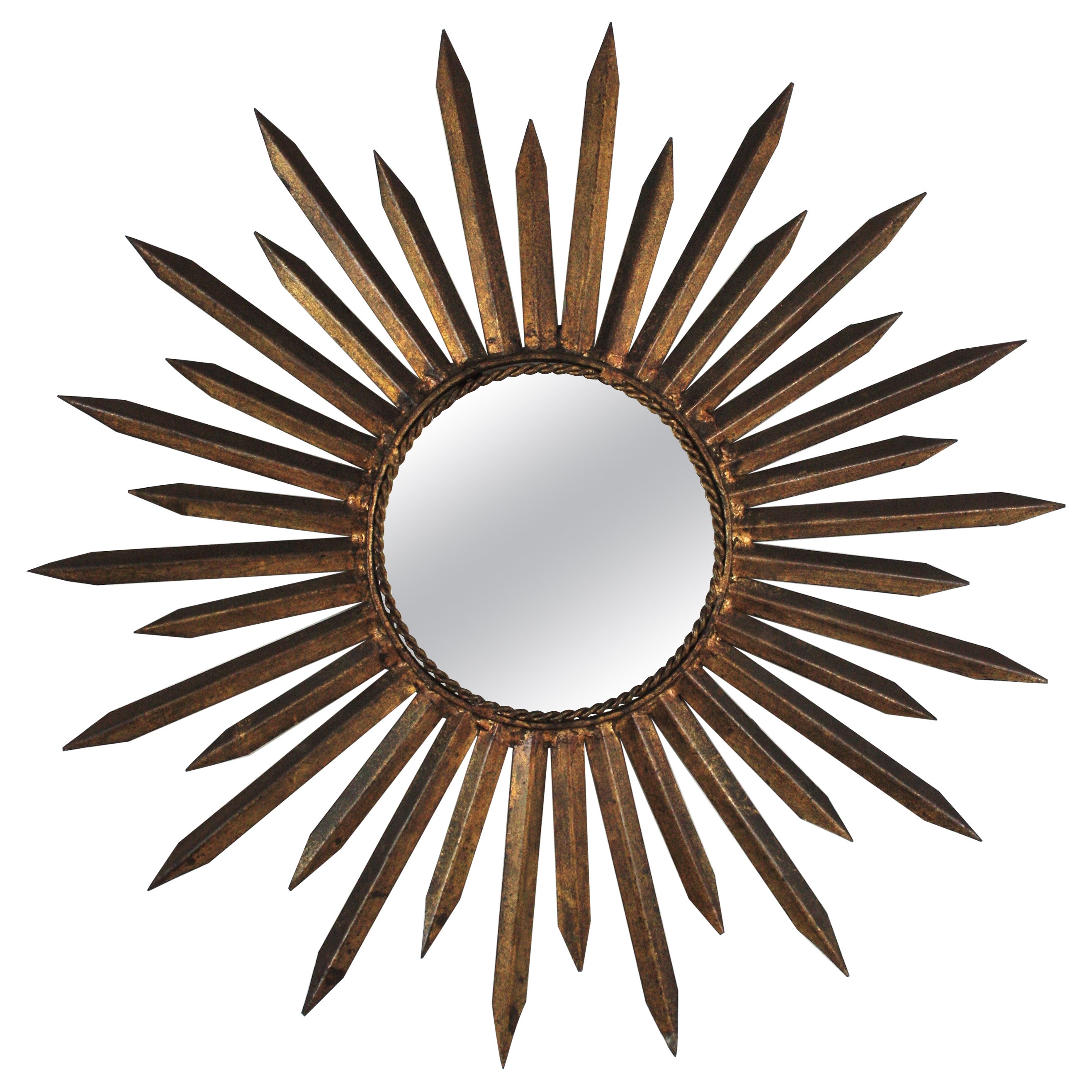 Miroir français en forme d'étoile de soleil en fer doré, style Gilbert Poillerat