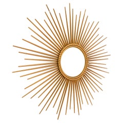 French Sunburst “Wind Chime” Mirror in the Manner of Line Vautrin, 1960s Golden