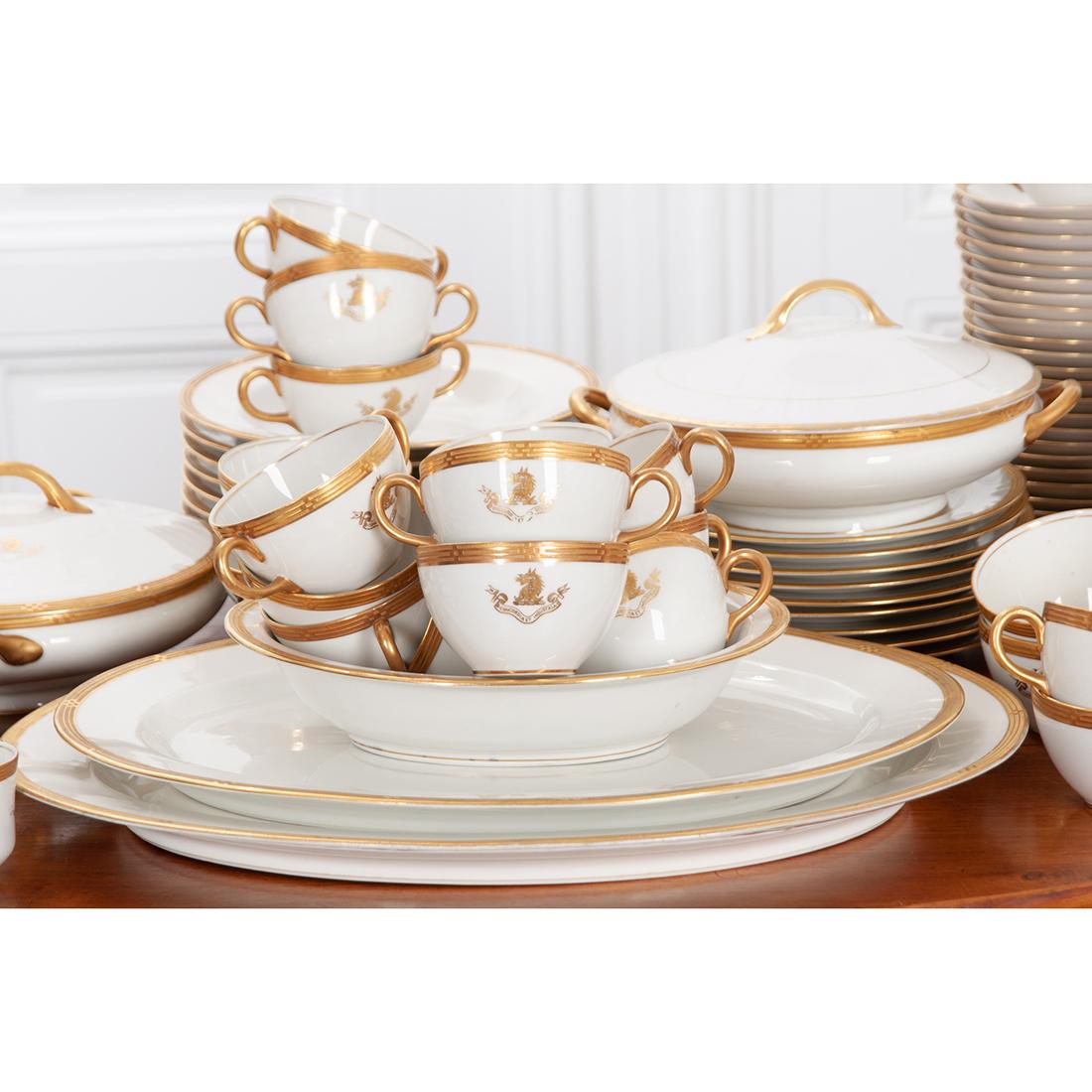 This fine, O.P. Co. Syracuse porcelain 132-piece service has the Dent family coat of arms as part of the gilt design on most of the pieces along with a unique gilt banding on all the pieces.

This service consists of:

11 dinner plates – 1”