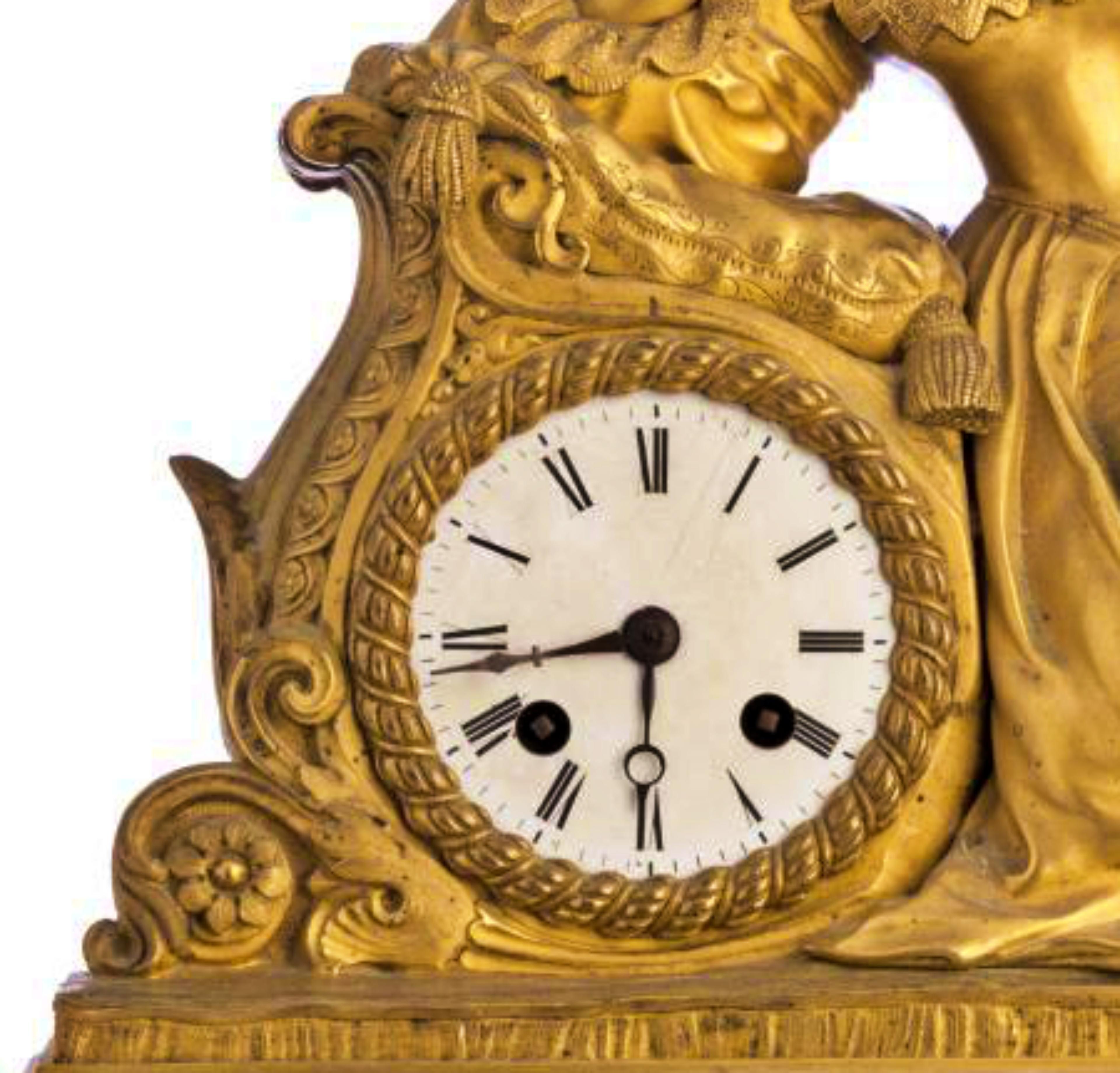 Table clock
French
gilded bronze Empire from the 19th century
decorated with female figure.
White enamel dial with black Roman numerals.
Measures: 43 cm x 54 cm.