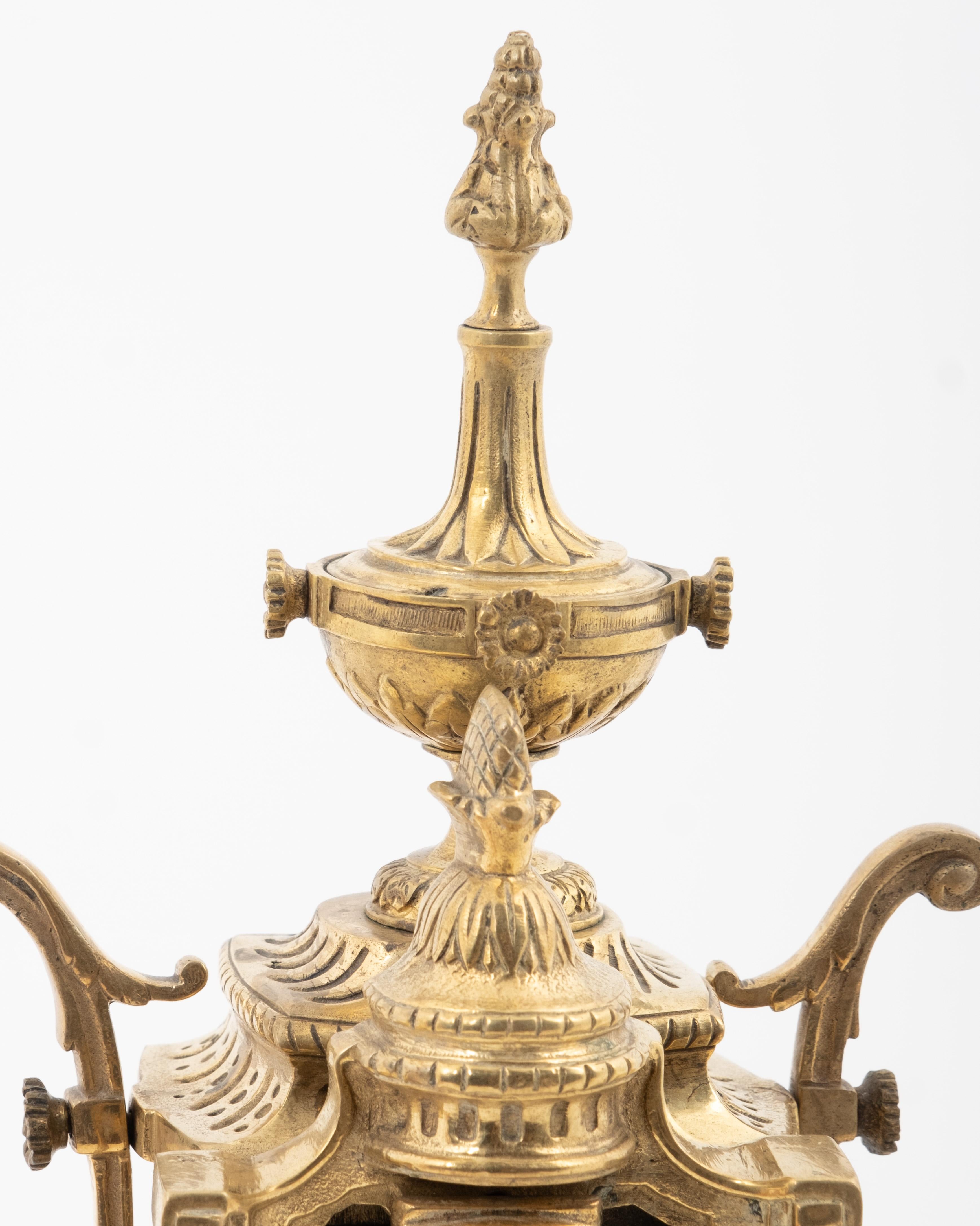 French tall bronze mantel clock in the Louis XVI style, dating from around 1890.

Measurements: 22 x 10 x 5 1/2 in. (55.9 x 25.4 x 14 cm.)
Weighs 18 lbs.