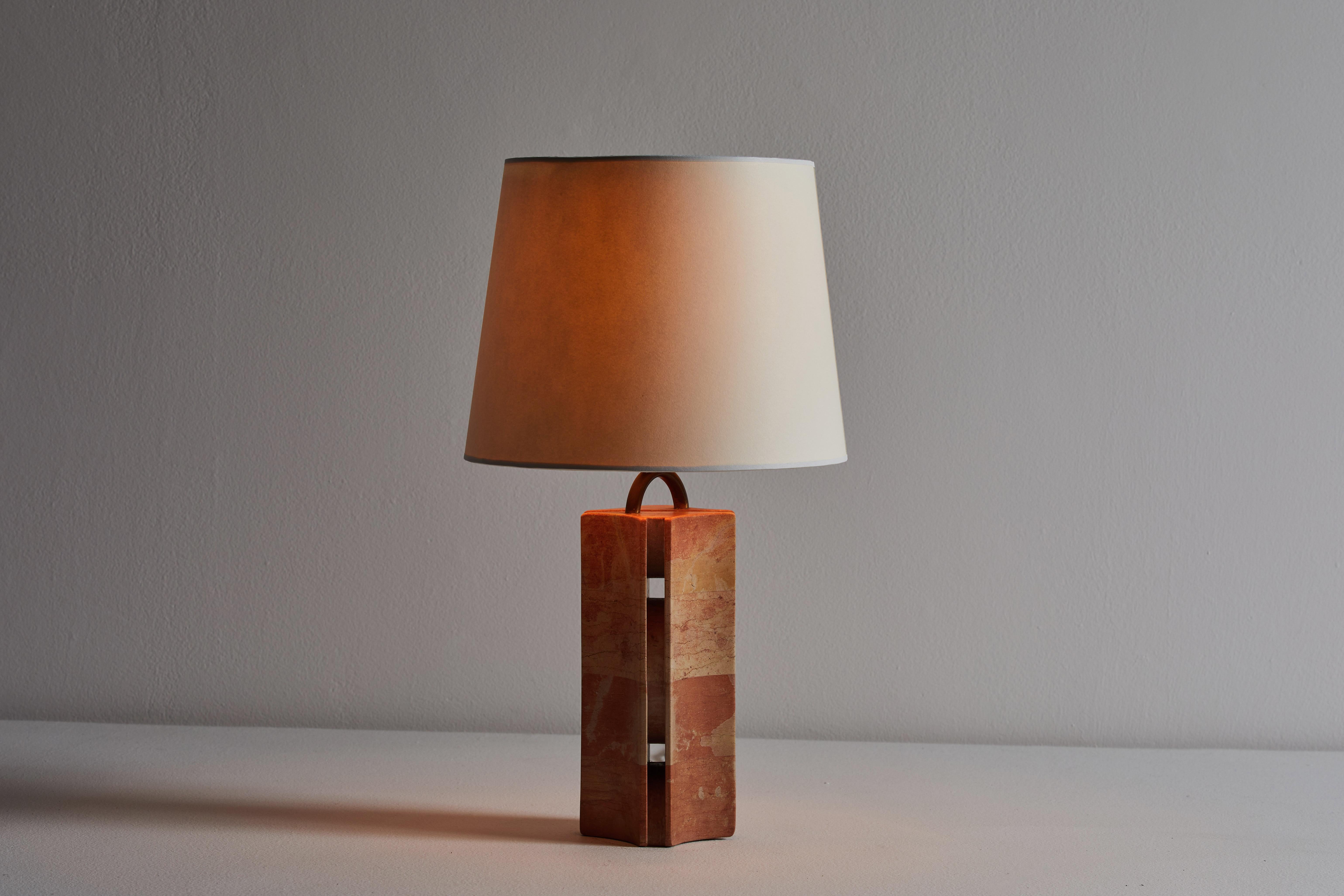 Table lamp manufactured in France, circa 1970s. French red marble, custom parchment shade, brass hardware. Original cord that requires a U.S. adaptor. We recommend one E26 40w maximum bulb. Bulbs provided as a one time courtesy. Overall height