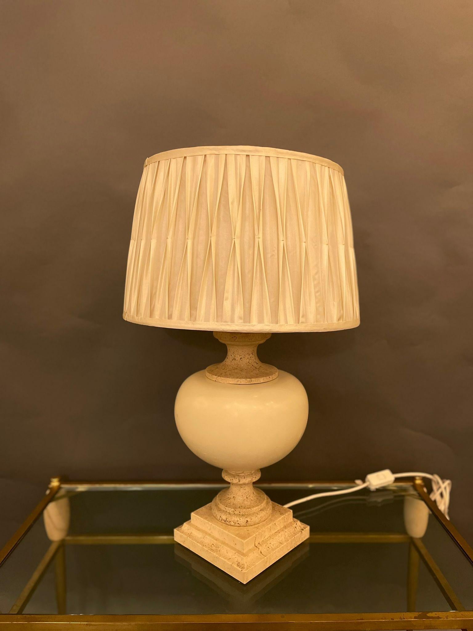 A fancy French table lamp in Travertine marble and ceramic. Circa 1960s.