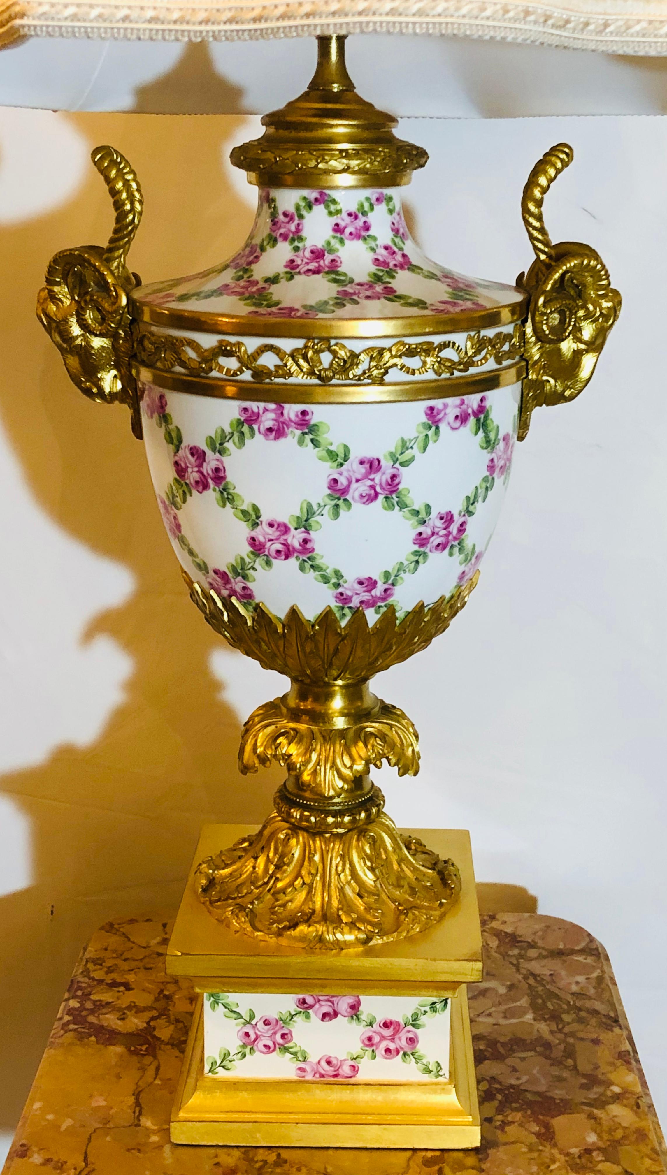 French table lamp trellis floral porcelain urn with bronze horned rams head gilt and bronze mounts. This spectacular urn now mounted as a lamp made in France possibly Sèvres has a fine custom shade and is certain to light up any room it sits in.