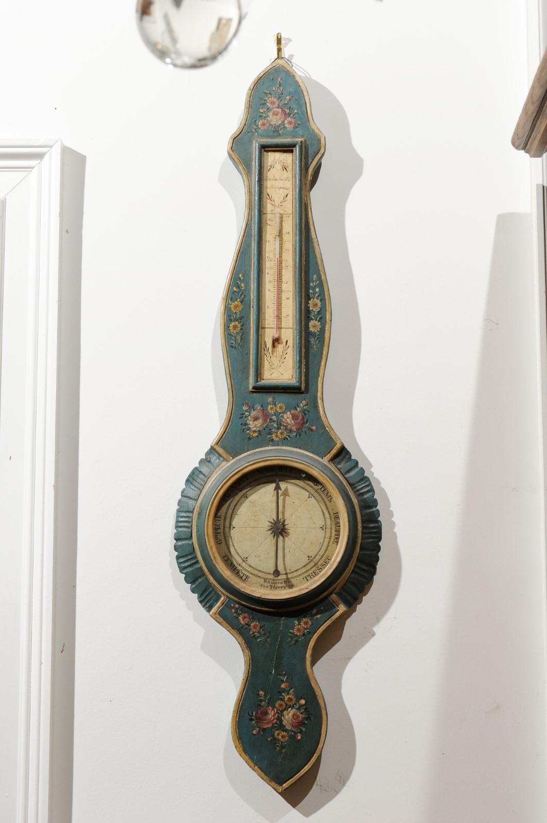 A French provençal wooden barometer from the late 18th century, with hand painted floral décor and thermometer. Born in Provence during the later years of the 18th century, this lovely barometer features a tall Silhouette, presenting sinuous