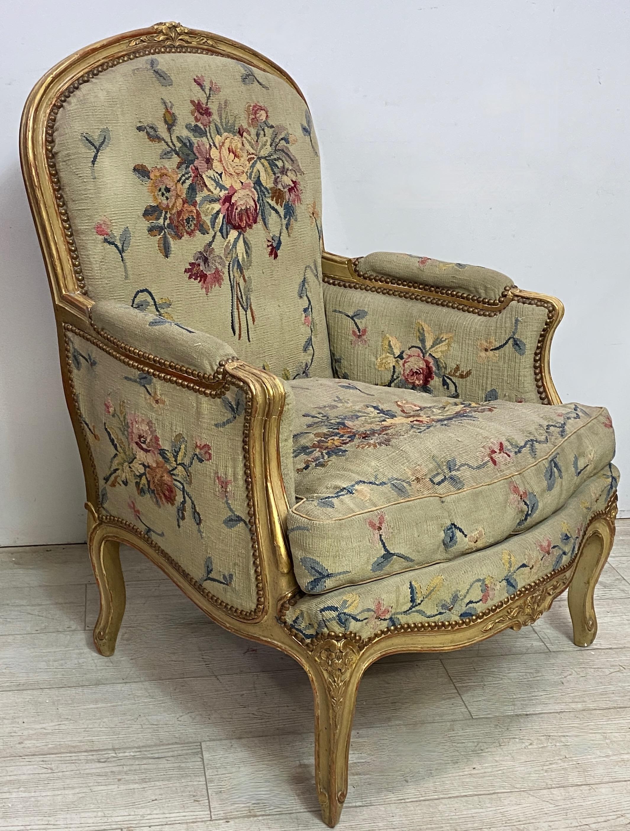 A hand crafted carved wood armchair upholstered with a hand woven wool tapestry in a floral design.
Having original paint and gilding. 
Recently cleared and refurbished. A very comfortable chair, sturdy and sound.
Early 20th century, France.
