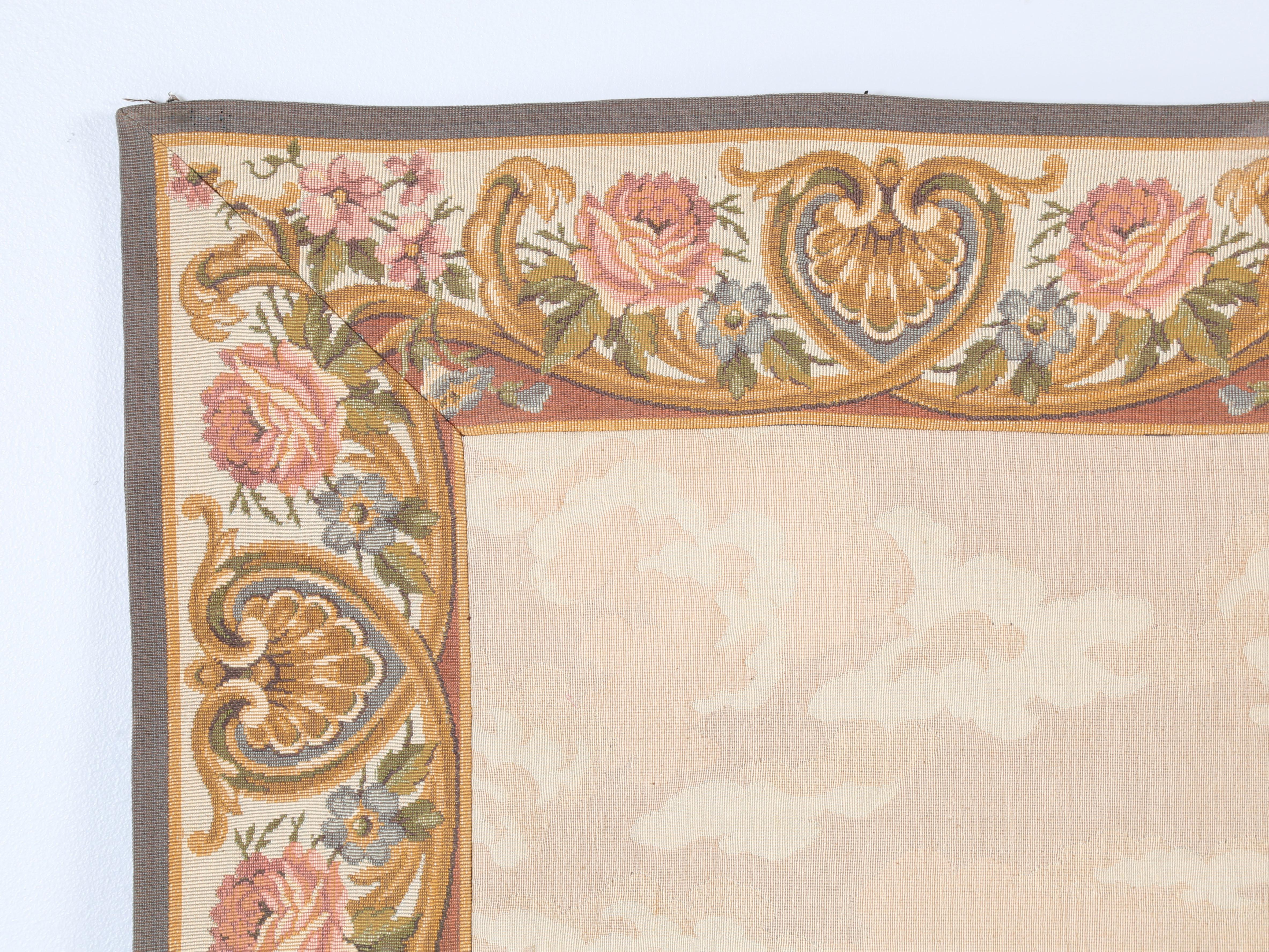 Vintage French Tapestry Panel with conveniently installed hooks on the reverse side for ease of hanging. We are certainly not French tapestry experts, but believe this was machine made and the original selling tag is on the reverse side marked
