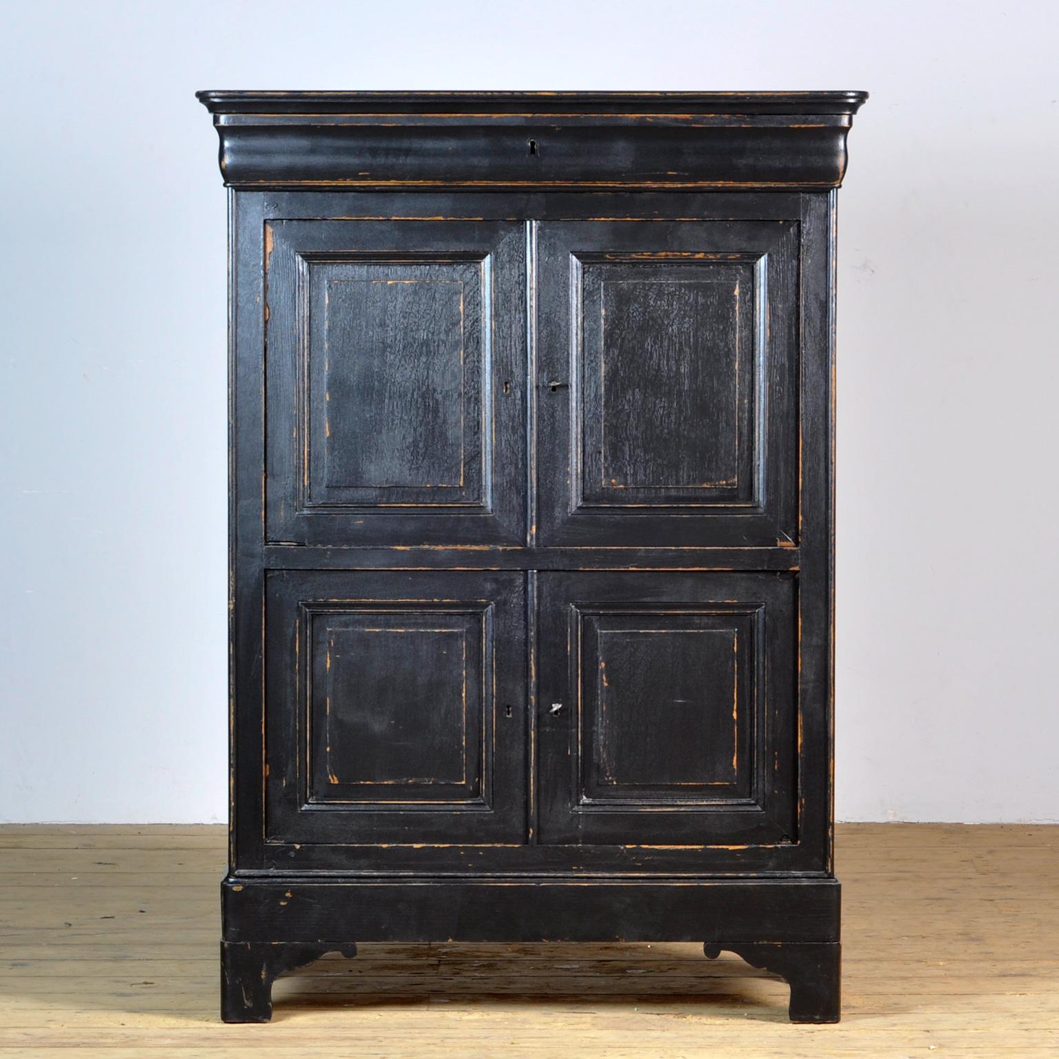 Teak maiden cabinet made in the 1940's in france. On the inside two shelves and a drawer on top and bottem.