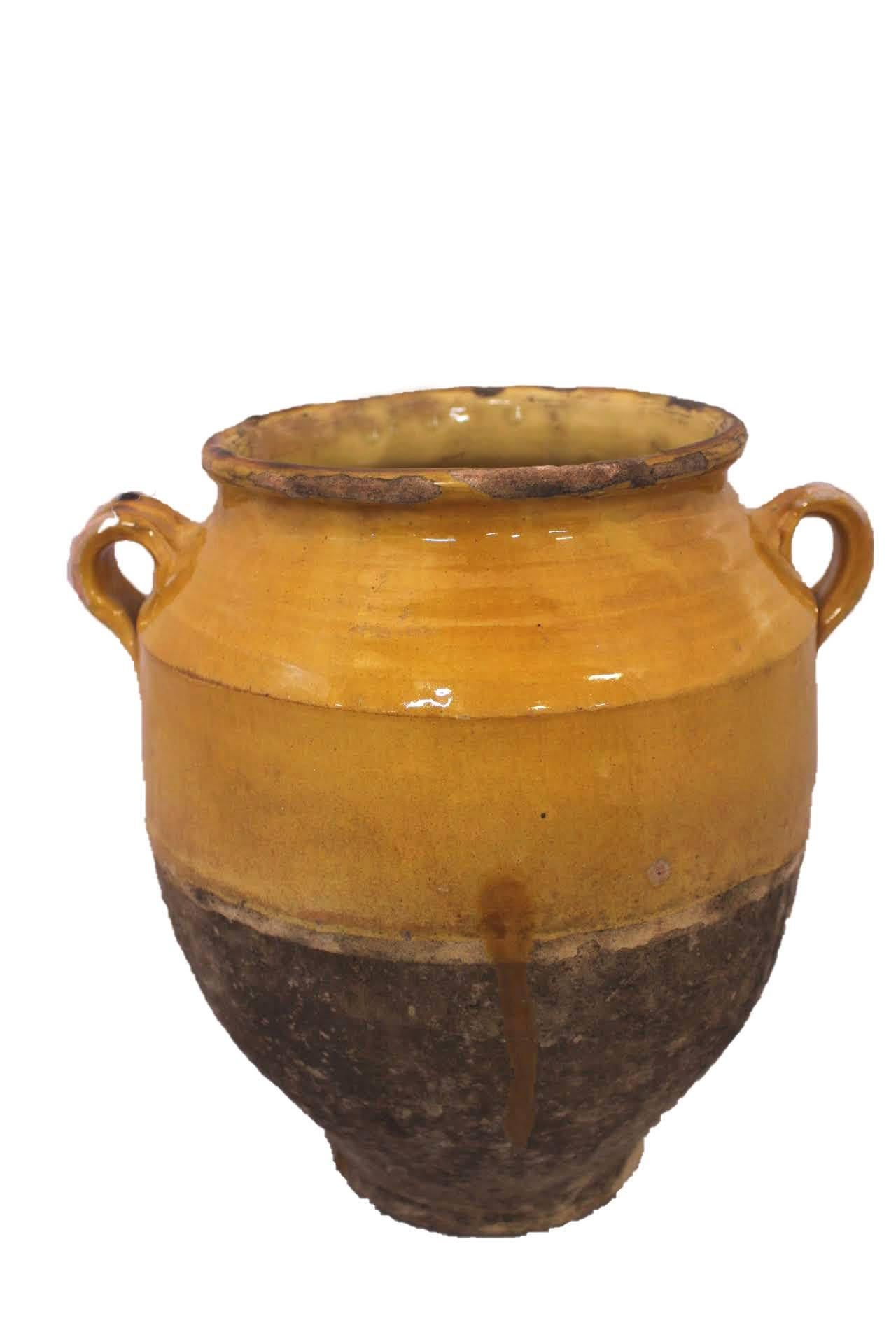 French terracotta confit pot
Traditional large earthenware pottery confit pot from South West France with yellow glaze
This vessel was used from the 19th to the mid-20th century to conserve food
Very decorative
Good patina and bright yellow